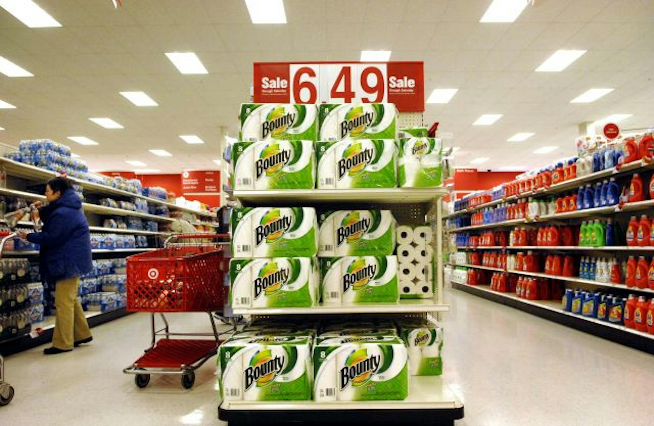 Target is turning to the more-is-less philosophy as it tries to persuade today's cost-conscious consumers that it can compete with the big warehouse stores on stock-up deals.