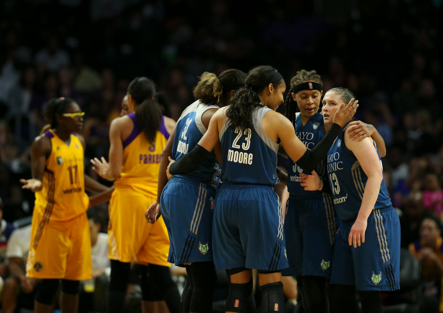 The Lynx players on the floor gathered for a huddle after Lynx forward Maya Moore (23) was fouled late in the fourth quarter on Game 4. At right are Minnesota Lynx guards Seimone Augustus (33) and Lindsay Whalen (13).