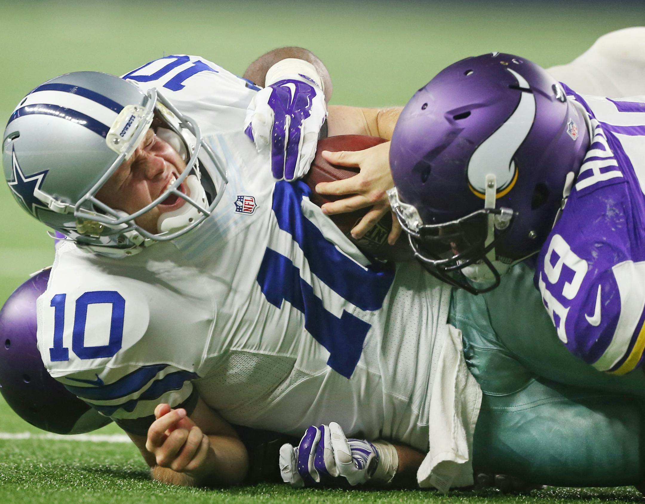 Dallas Cowboys quarterback Dustin Vaughan (10) was sacked by Minnesota Vikings defensive end Danielle Hunter (99) in the third quarter. The Dallas Cowboys played the Minnesota Vikings at AT&T Stadium Saturday August 29 2015 in Arlington, TX. ] Jerry Holt/ Jerry.Holt@Startribune.com