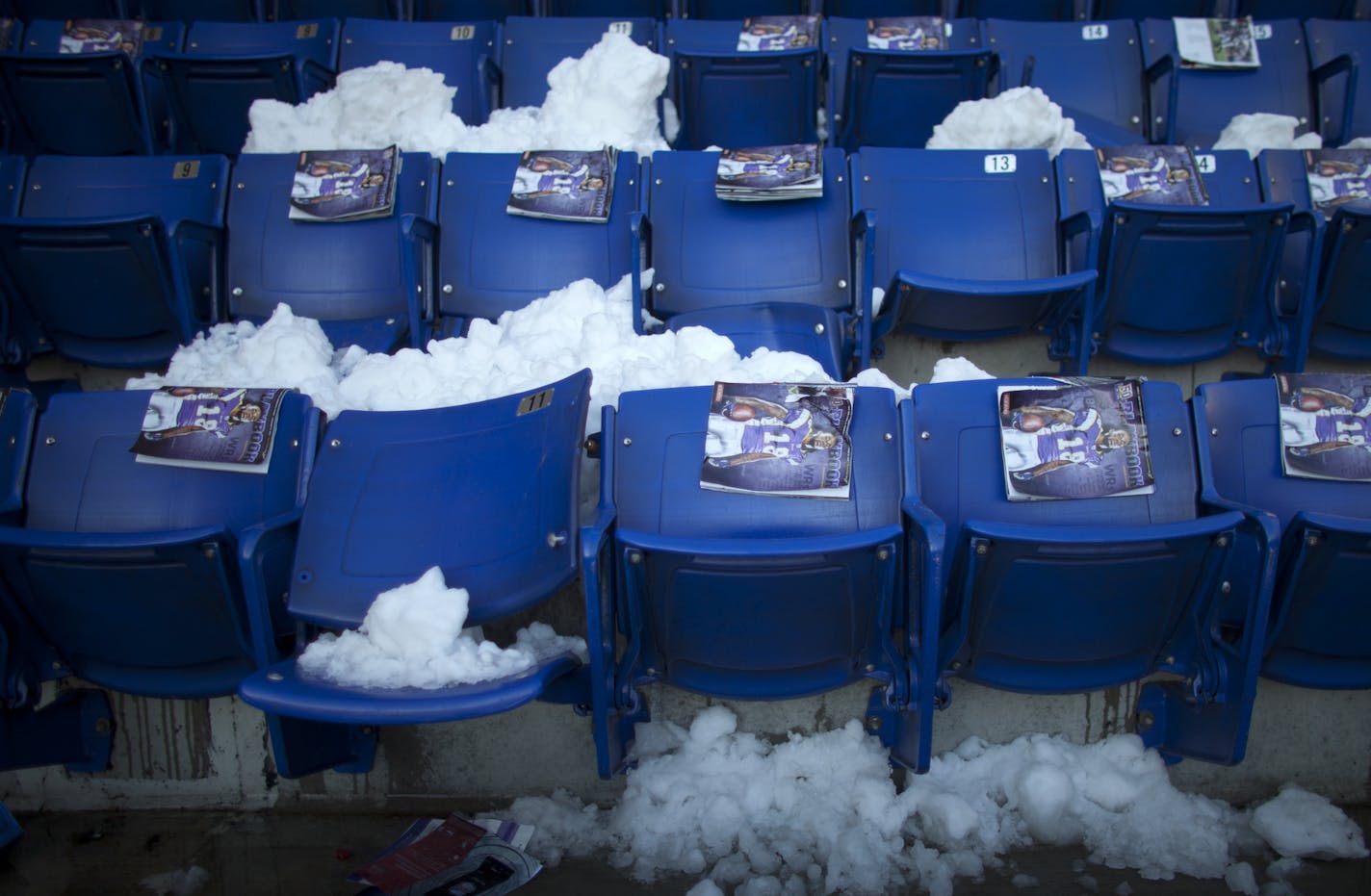 JEFF WHEELER &#x201a;&#xc4;&#xa2; jeff.wheeler@startribune.com MINNEAPOLIS - 12/12/10 - For the second time in the building's history, the Metrodome roof collapsed due to snow and high winds Saturday night, forcing the postponement of Sunday's Vikings game against the New York Giants. IN THIS PHOTO ] Programs were awaiting fans on the seats of the Metrodome Sunday morning. Snow fell through the gaping hole in the roof and landed on seats in the upper deck. ORG XMIT: MIN2013120416045578