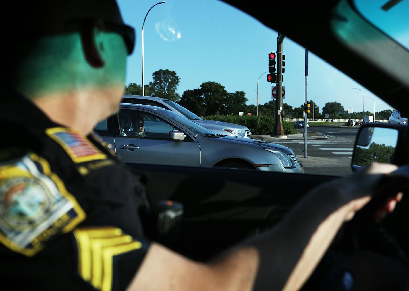 Hopkins police officer Sgt. Mike Glassberg was out patrolling Hopkins roads looking for violators on the first day of the new hands free law Thursday, Aug. 1, 2019, in Hopkins, MN. Here, Sgt. Glassberg kept an eye out for drivers holding a phone.] DAVID JOLES &#x2022; david.joles@startribune.com The state's new hands free law kick in Thursday and drivers who hold a phone or other electronic device in their hands should not expect to receive a warning from police. Both the Hopkins and Eagan depar