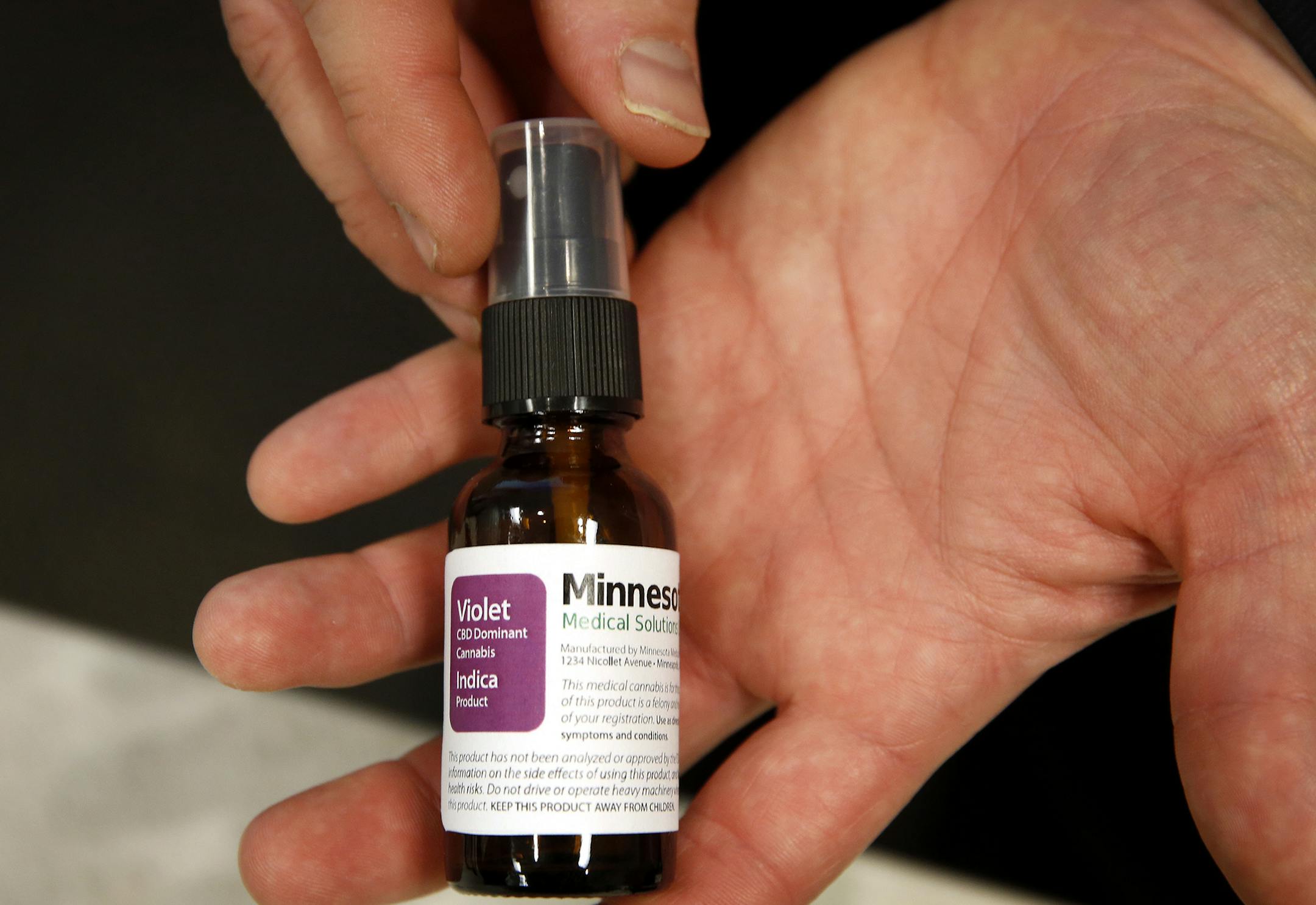 An example of how the tincture cannabis product packaging will look from Minnesota Medical Solutions during a press conference at the Minnesota Department of Health in St. Paul on Monday, December 1, 2014. ] LEILA NAVIDI leila.navidi@startribune.com /