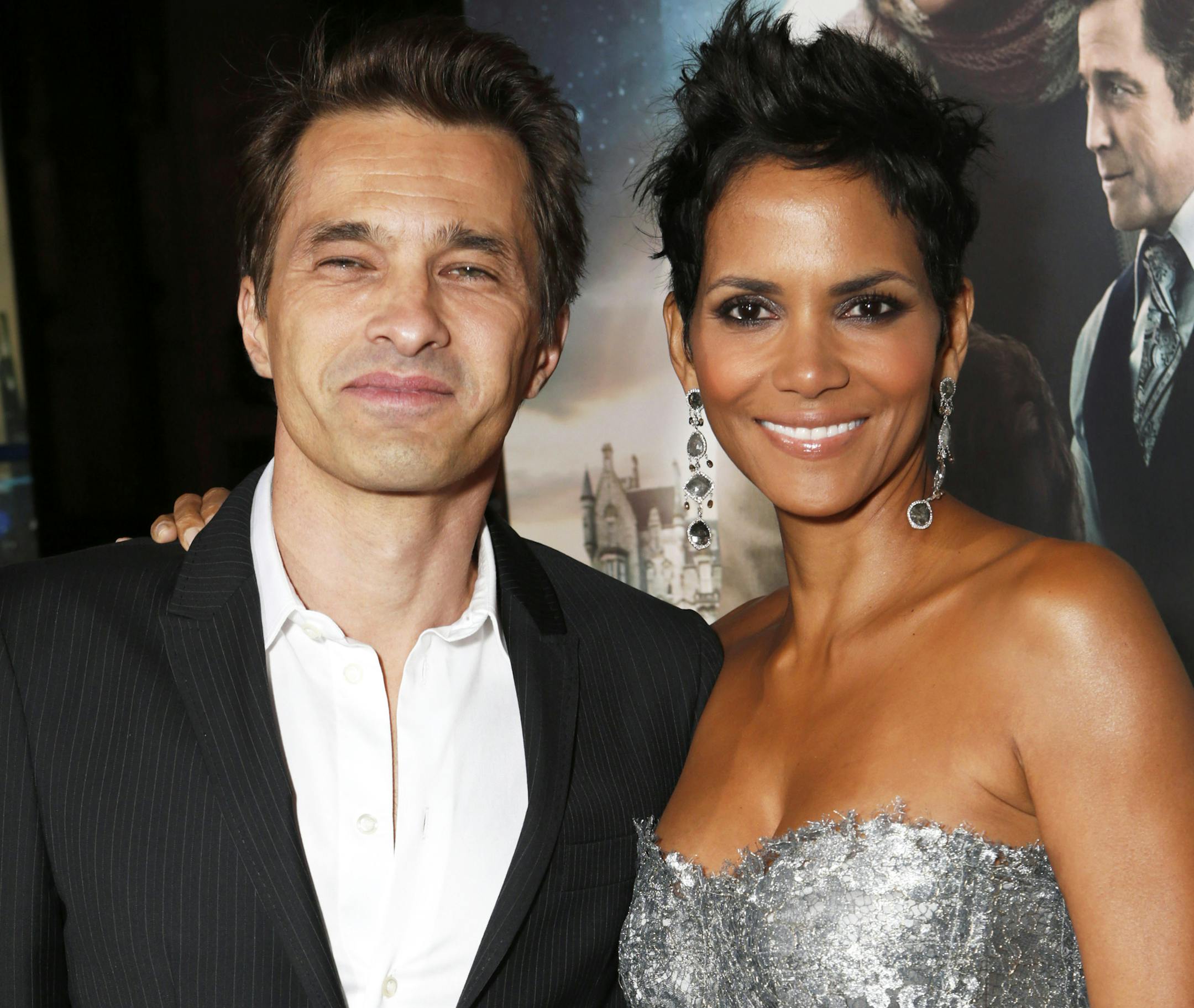 FILE - This Oct. 24, 2012 file photo shows actors Olivier Martinez, left, and Halle Berry at the Los Angeles premiere of Berry's film, "Cloud Atlas," in the Hollywood section of Los Angeles. Berry has married Martinez at a weekend ceremony in a church near a chateau in France's Burgundy region. The owner of the Chateau de Vallery, where the couple stayed with their 60 guests, said on Sunday July 14, 2013, that the betrothal a day earlier ended with a dinner and fireworks display. (Photo by Todd