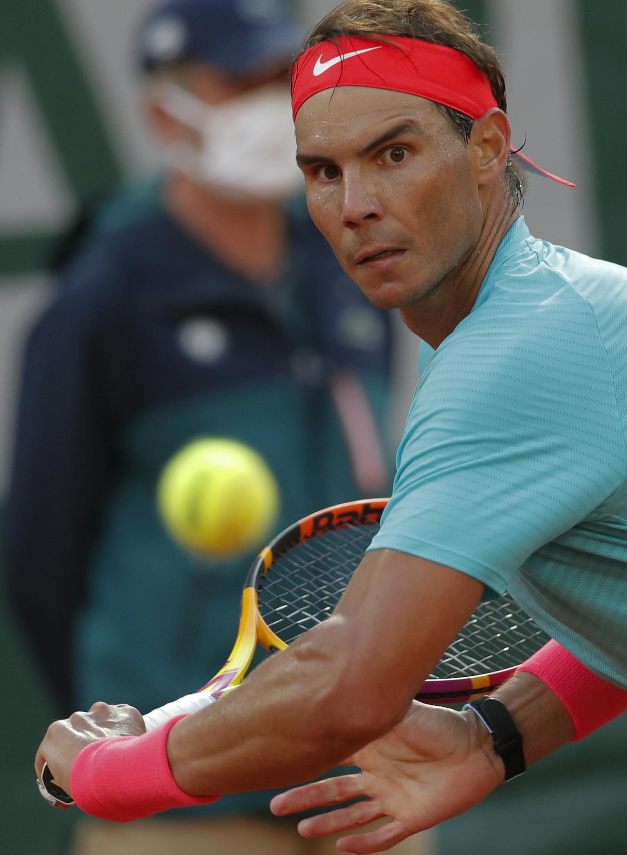 Spain's Rafael Nadal plays a shot against Argentina's Diego Schwartzman in the semifinal match of the French Open tennis tournament at the Roland Garros stadium in Paris, France, Friday, Oct. 9, 2020. (AP Photo/Michel Euler)