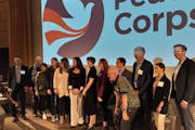 Peace Corps Director Carol Spahn (center in white pants) is joined by former Peace Corps volunteers at the Minnesota International NGO Network Annual 