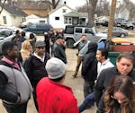 Commuters waited outside Rapid Response in St. Paul to retrive their cars that has been towed Monday from the Woodbury Theater Park and Ride.