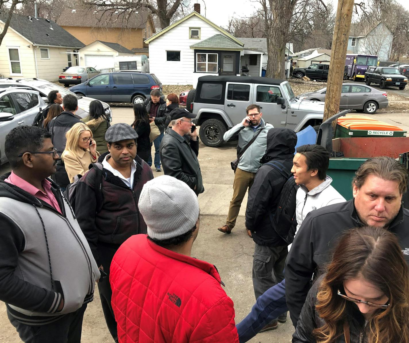 Commuters waited outside Rapid Response in St. Paul to retrive their cars that has been towed Monday from the Woodbury Theater Park and Ride.