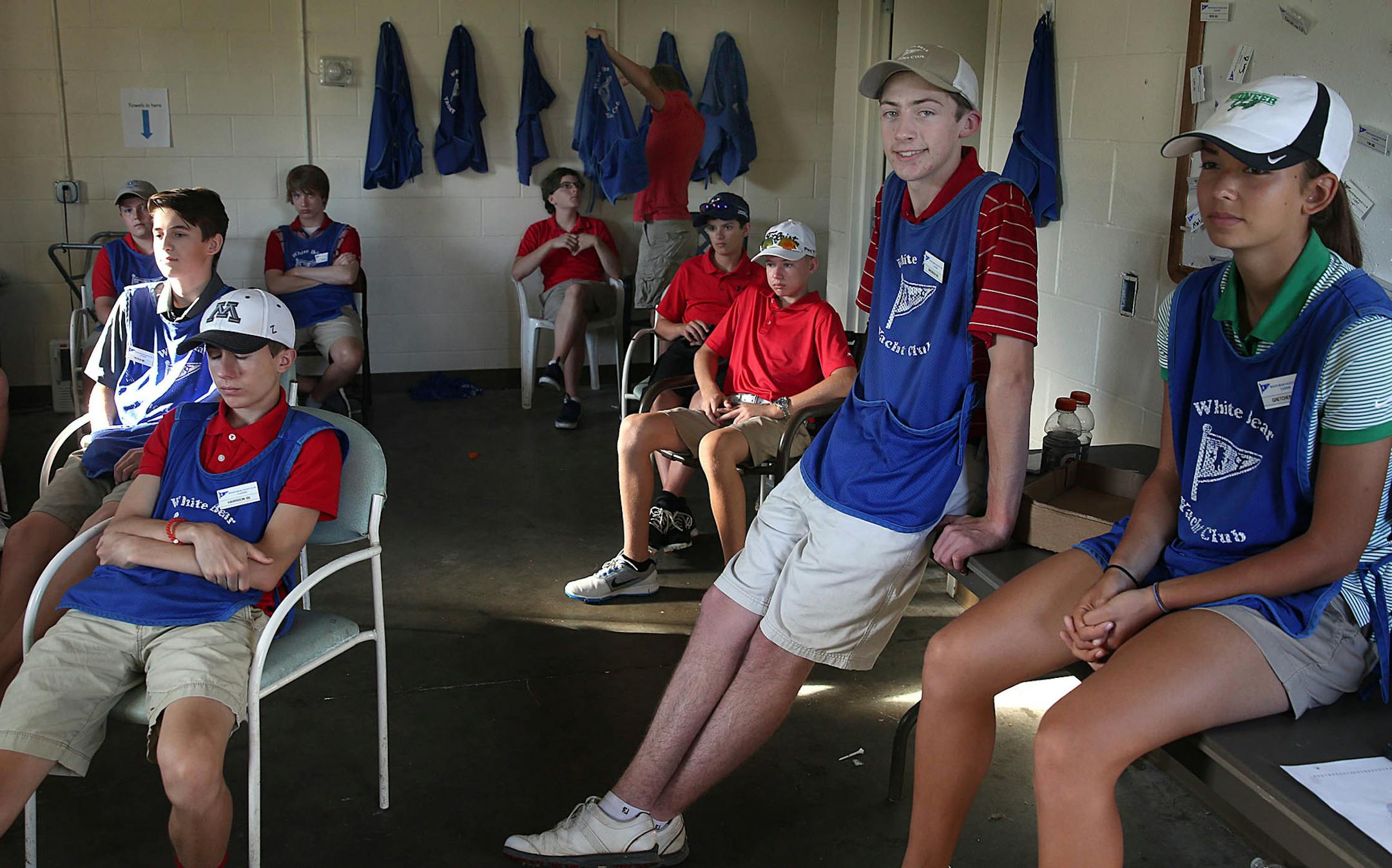 Evans Scholar Brenden Petersen (second from right) caddies at White Bear Lake Yacht Club. ] JIM GEHRZïjames.gehrz@startribune.com (JIM GEHRZ/STAR TRIBUNE) / June 11, 2016/ 7:20 AM , Dellwood, MN - BACKGROUND INFORMATION: A look at the Evans Scholars and the lives changed by the program that sends young caddies to universities on full rides. Chick Evans' U.S. Open win in Minneapolis was 100 years ago this summer. Photo to shoot Brenden Petersen, the lede to Chip's Evans Scholar story. He's a