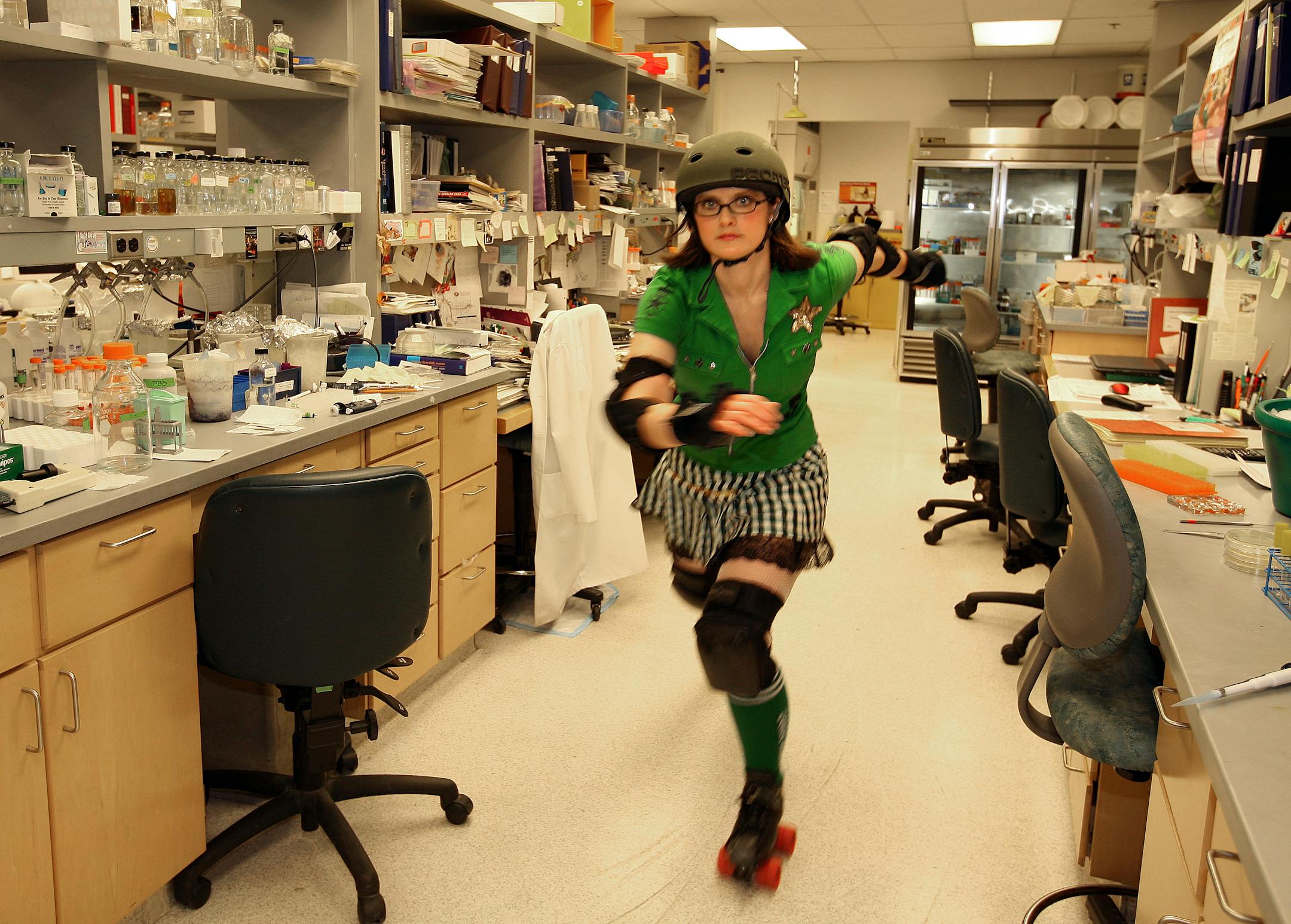 The beginning of the fourth season of roller derby kicks off Feb 24. Four teams represented by members working in all walks of life make and interesting twist to names and personalities on the hardwood. Rachael Herder, aka "Ann E. Briated," in her lab on the university campus where she studies the steroids in fruit flies as part of her thesis.