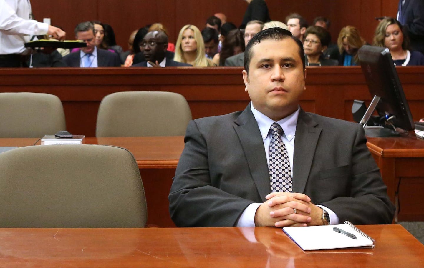 George Zimmerman waits for his defense counsel to arrive in Seminole circuit court, on the 11th day of his trial, in Sanford, Florida, Monday, June 24, 2013. Zimmerman is accused in the fatal shooting of Trayvon Martin.