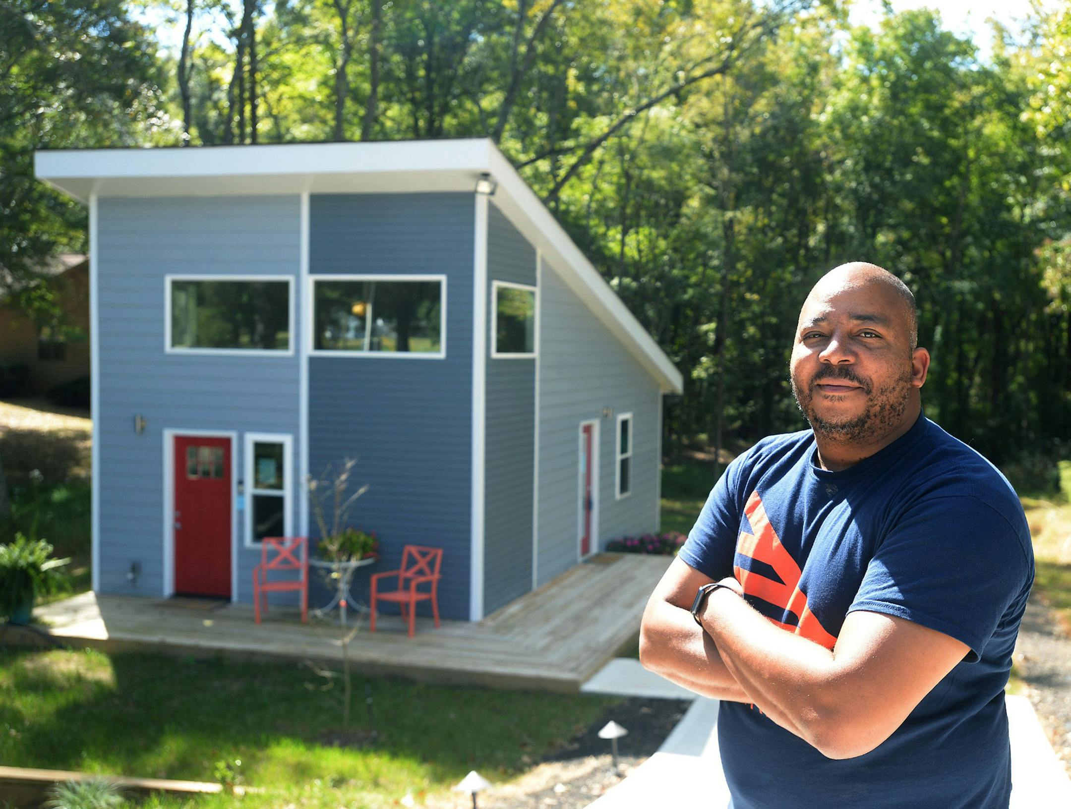 Developer Kevin Young in front of a tiny house at his tiny house development in northwest Charlotte, N.C. Neighbors iare upset about his planned development of tiny houses. (Diedra Laird/Charlotte Observer/TNS)