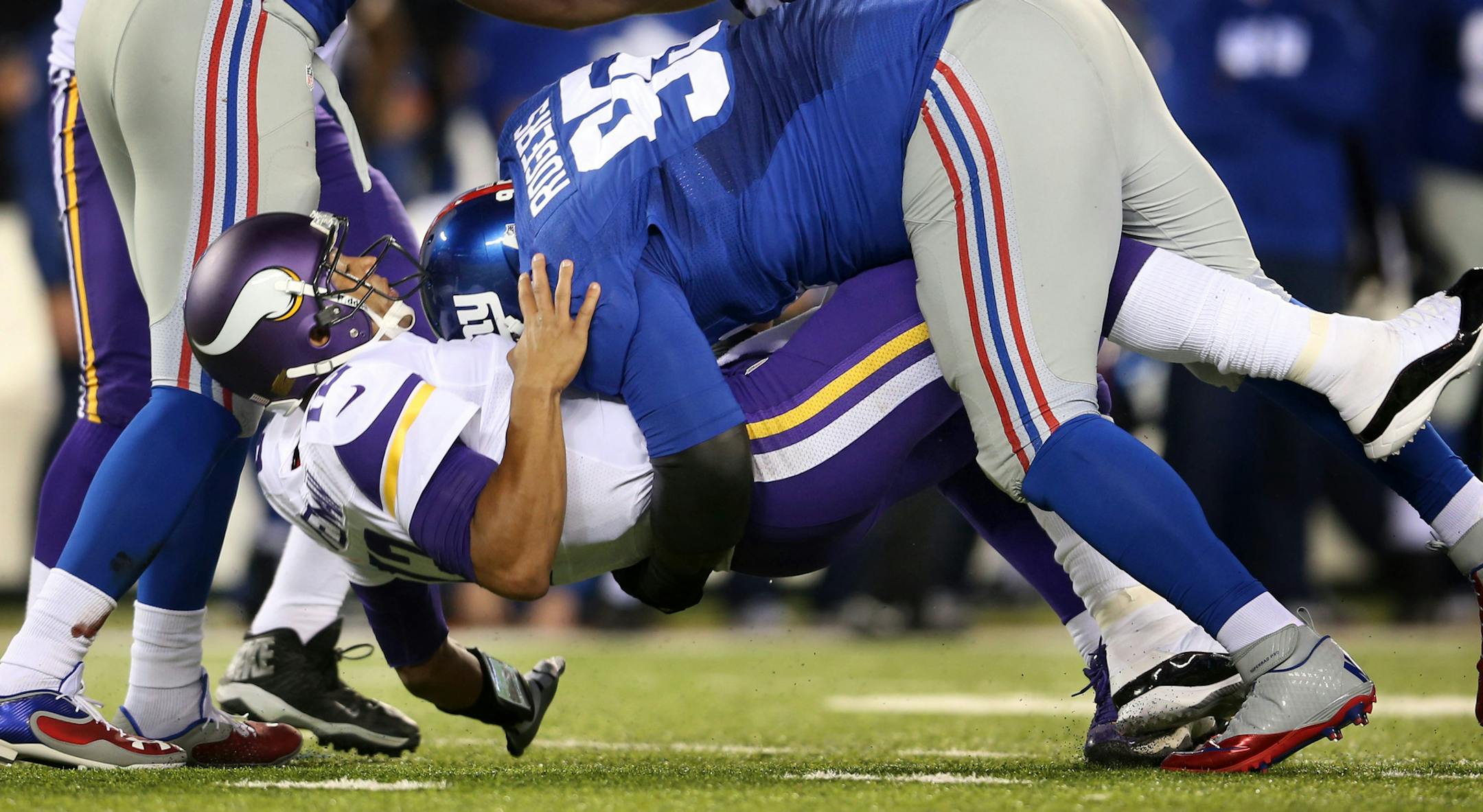 Quarterback Josh Freeman was hit by defensive tackle Shaun Rogers shortly after throwing the ball in the fourth quarter. Freeman said the concussion symptoms he felt were from a hit in the third quarter of the 23-7 loss to the Giants.