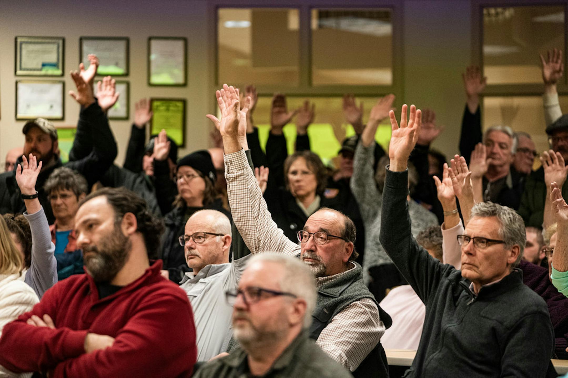 Those in favor of refusing refugee resettlement in Beltrami County raised their hands Tuesday as the County Board prepared to vote.