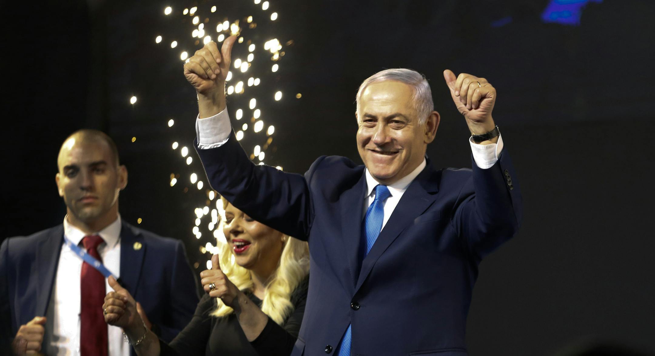 Israel's Prime Minister Benjamin Netanyahu waves to his supporters after polls for Israel's general elections closed in Tel Aviv, Israel, Wednesday, April 10, 2019. (AP Photo/Ariel Schalit)