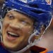 New York Islanders center Keith Aucoin (10) and Kyle Okposo (21) celebrate their 4-1 win over the Philadelphia Flyers in an NHL hockey game in Unionda