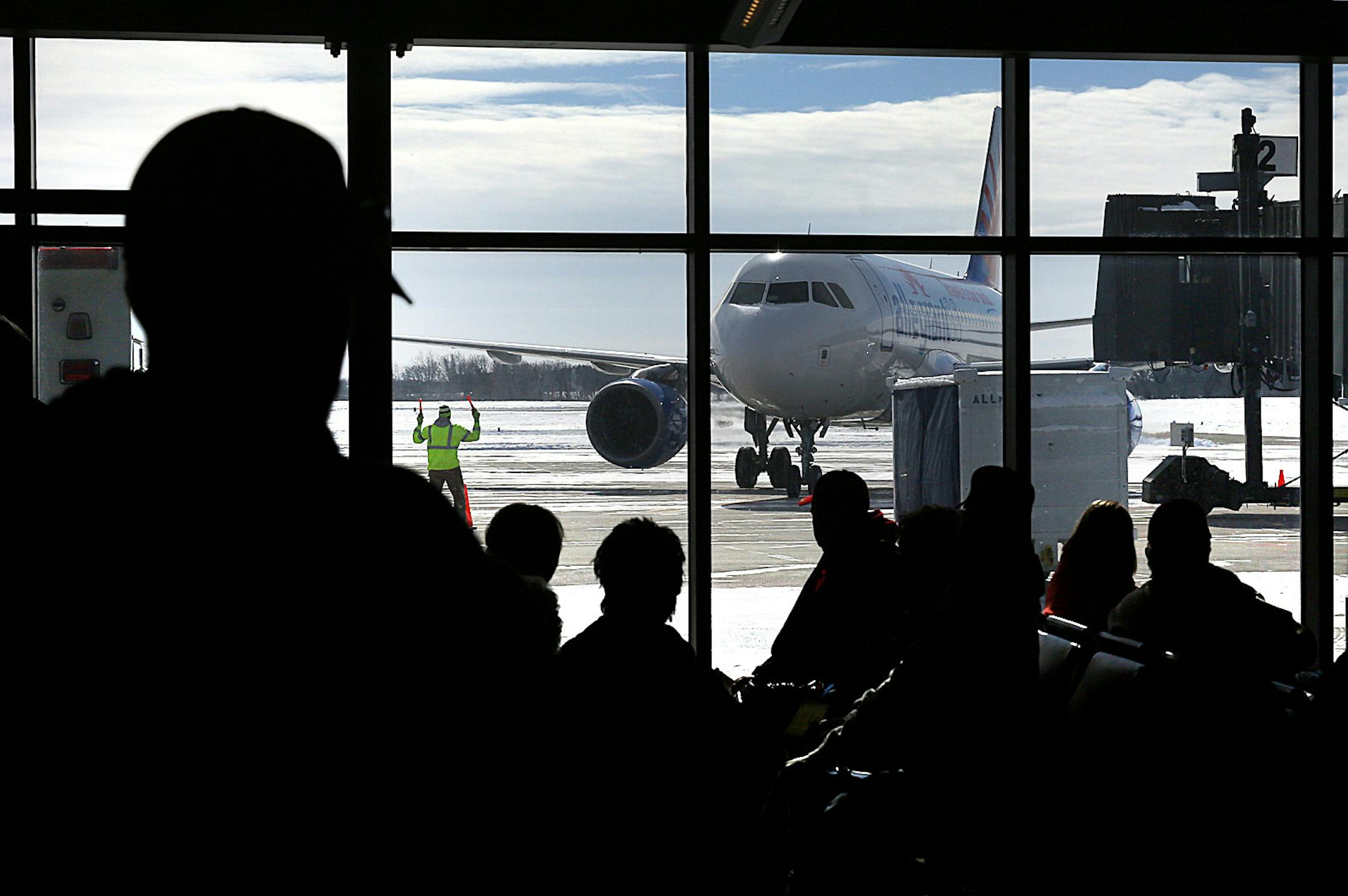 Passengers watch the arrival of a flight from Phoenix in the terminal at the St. Cloud Regional Airport in anticipation of boarding the aircraft for the return flight to Arizona. ] JIM GEHRZ ‚Ä¢ jgehrz@startribune.com / St. Cloud, MN / February 26, 20134/ 11:00 AM - BACKGROUND INFORMATION: Five years after Delta pulled its service from Minnesota's smaller airports amid a dismal time for airlines, there are signs of resurgence. St. Cloud will start daily service to Chicago soon.