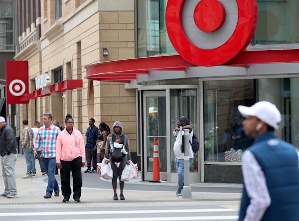 People walking outside Target store on Nicollet Mall in downtown Minneapolis.