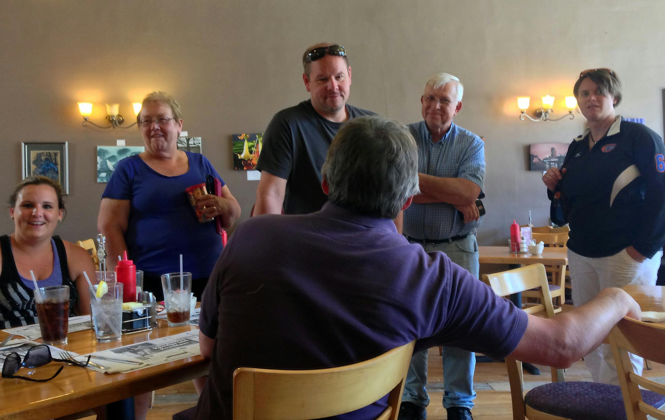 Friends and family gathered in the Henderson RoadHaus restaurant to compare flood stories ]Flooding and the aftermath of heavy rains are still being felt in Henderson, several roads are closed by mudslides and flooding..Richard.Sennott@startribune.com Richard Sennott/Star Tribune Henderson Minn. Saturday 6/21/2014) ** (cq)
