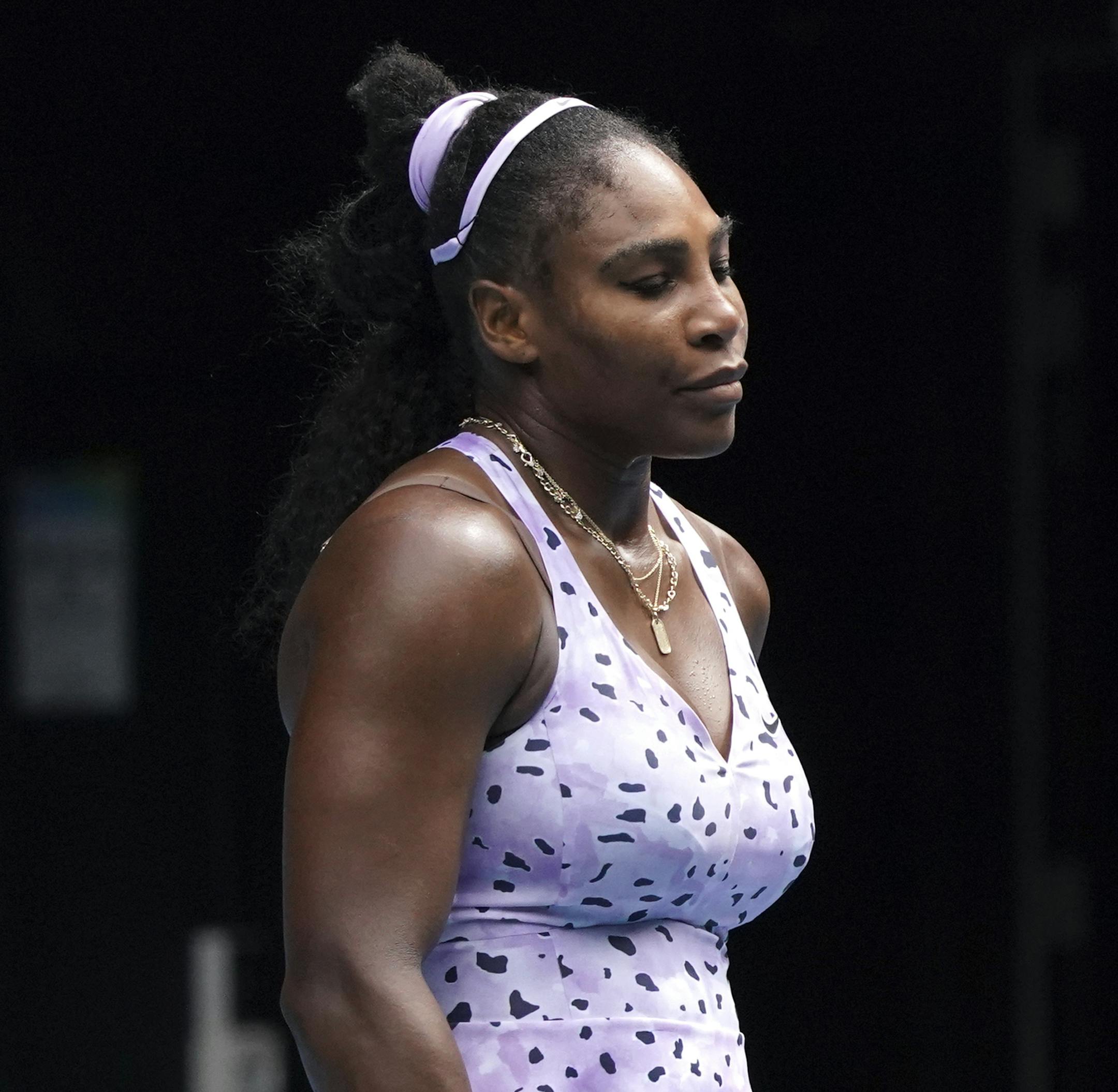 Serena Williams of the U.S. reacts after the third round loss to China's Wang Qiang at the Australian Open tennis championship in Melbourne, Australia, Friday, Jan. 24, 2020. (AP Photo/Lee Jin-man)