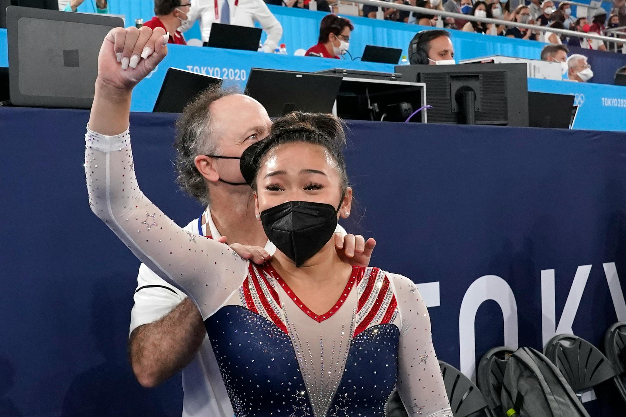 Suni Lee, of the United States, celebrates with her coach Jeff Graba after she won the gold medal in the artistic gymnastics women's all-around at the 2020 Summer Olympics, Thursday, July 29, 2021, in Tokyo. (AP Photo/Gregory Bull)