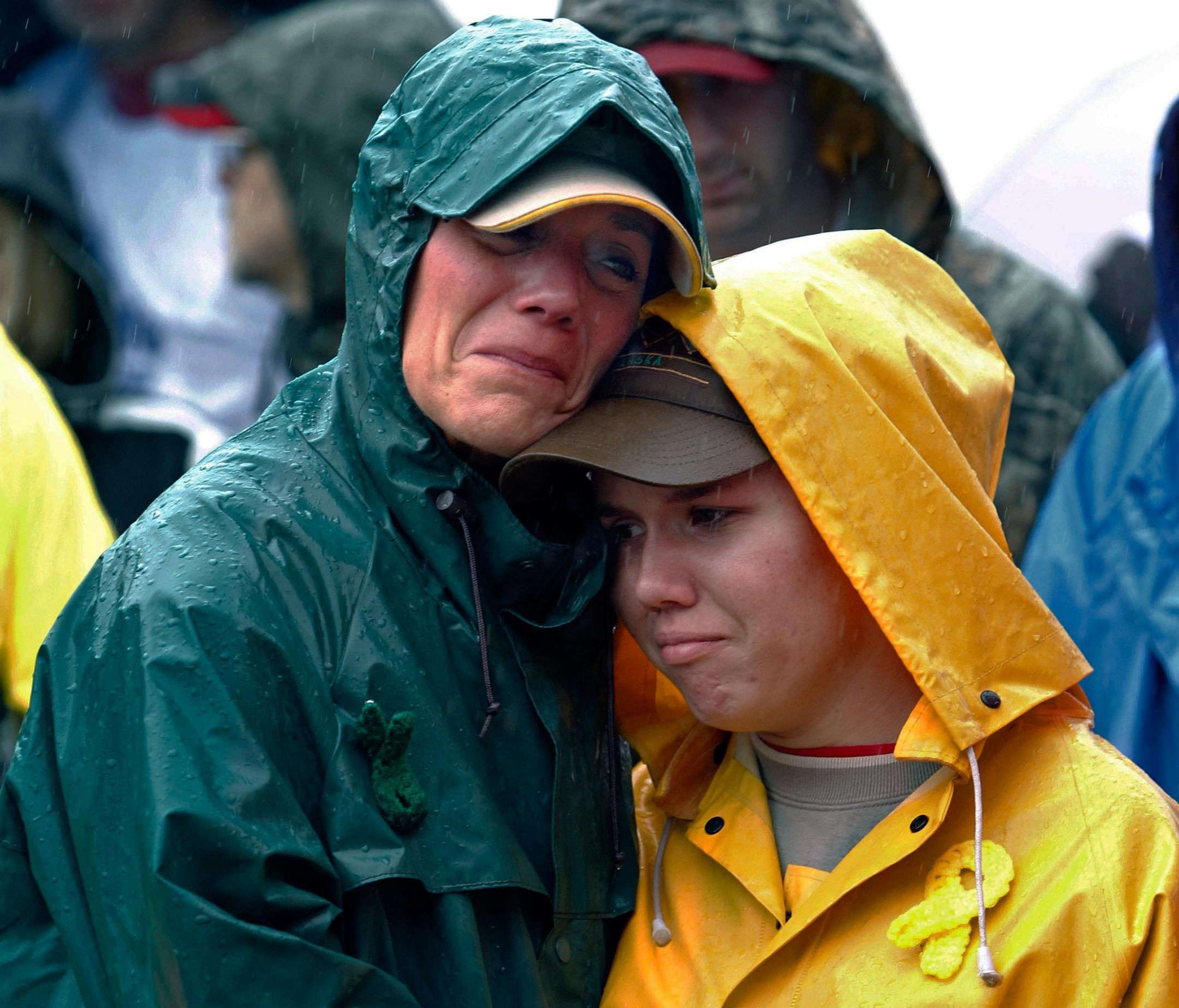 FILE - During a moment of silence, Joan Olsen, left, and her daughter Emily Olsen embrace at the start of the Walk for Suicide Awareness in Kaukauna, Wis. on Saturday, Sept. 11, 2010. Joan and Emily are honoring Chris Olsen, who is Joan's husband and Emily's father. The suicide rate among middle-aged Americans climbed a startling 28 percent in the decade between 1999 and 2010, the government reported Thursday, May 2, 2013, but the rates in younger and older people did not change. (AP Photo/Post-