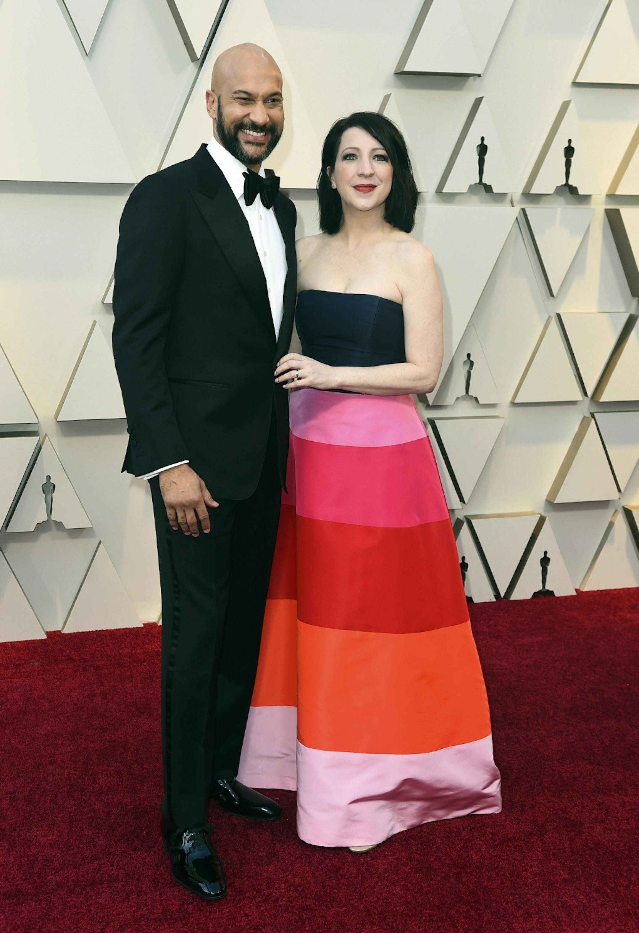 Keegan-Michael Key, left, and Elisa Pugliese arrive at the Oscars on Sunday, Feb. 24, 2019, at the Dolby Theatre in Los Angeles.