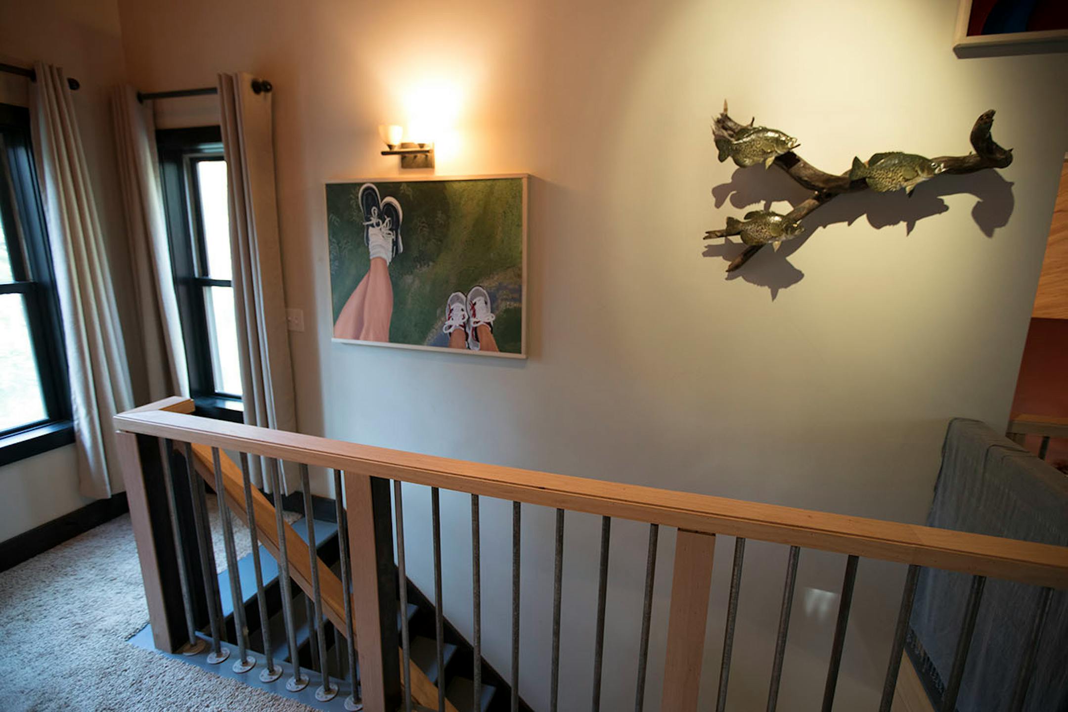 The second floor landing area gives a great perspective to a couple pieces of the Anderson collection of artwork.
