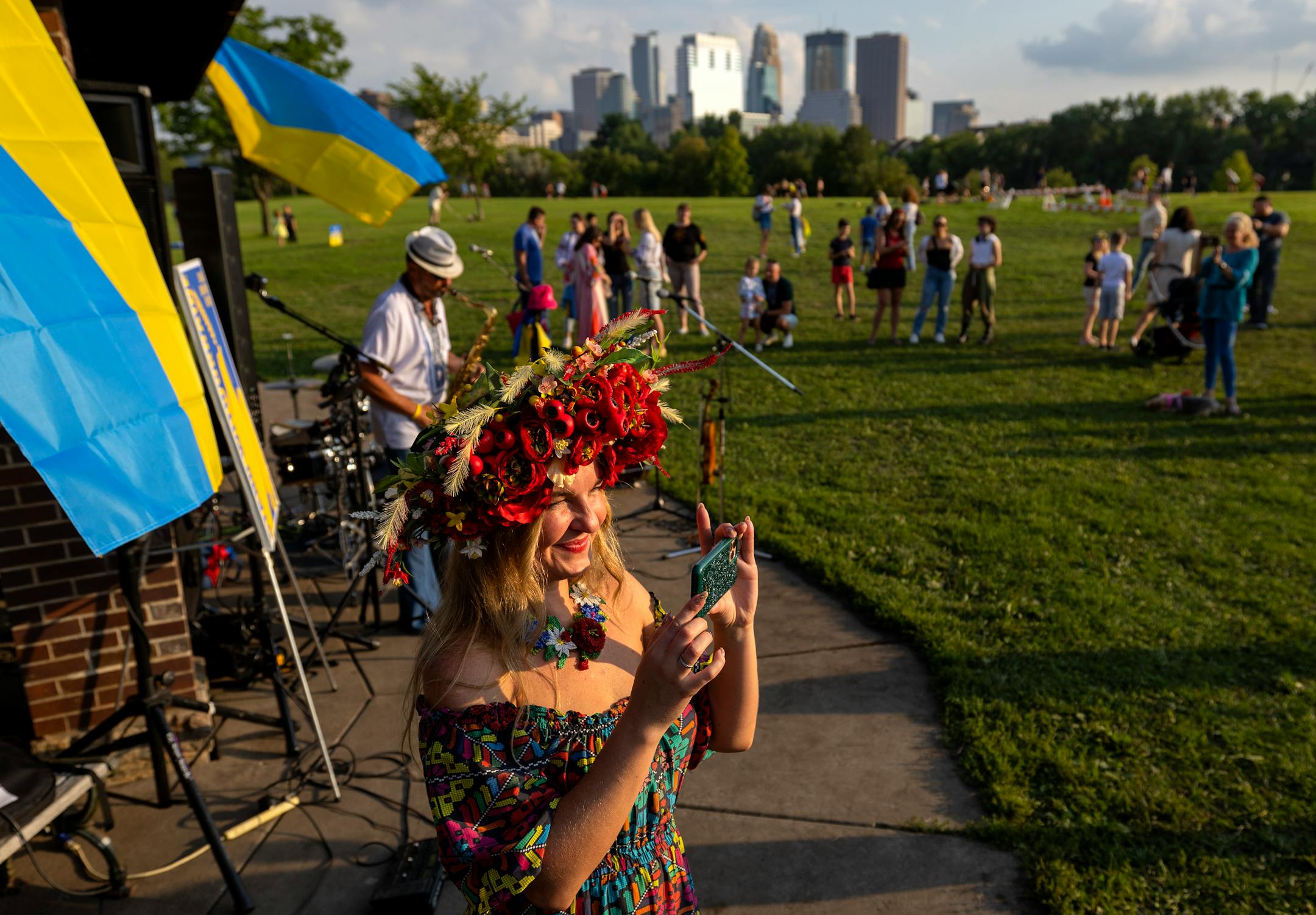 Viktoriya Kantor, of Savage scans the scene with her phone.