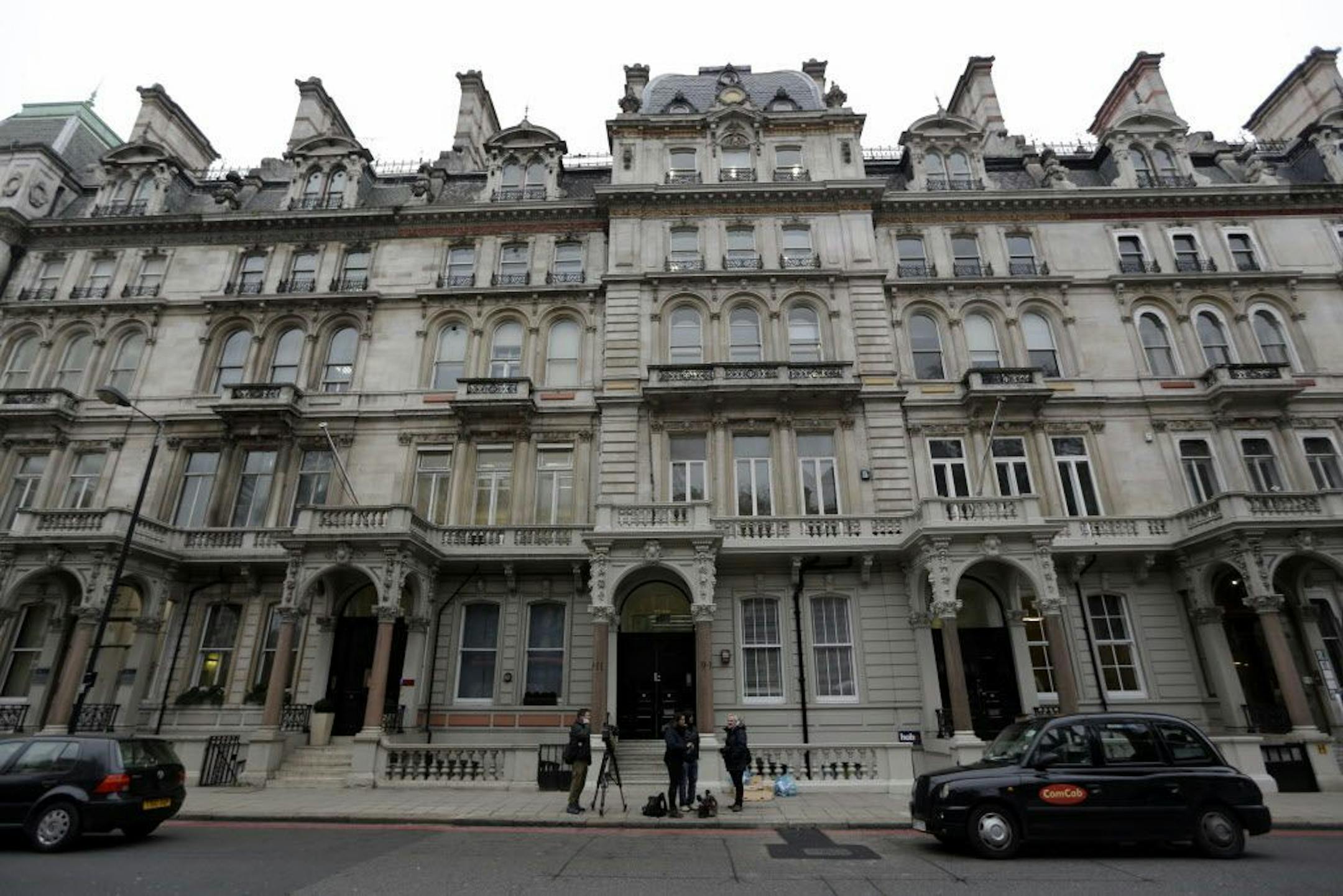 Members of the media stand outside a building where offices of Orbis Business Intelligence Ltd are located, in central London, Thursday Jan. 12, 2017. An unsubstantiated dossier on US President elect, Donald Trump, which has been circulating in Washington for months, was compiled by a former Western intelligence operative, identified Wednesday by The Wall Street Journal as Christopher Steele of London-based Orbis Business Intelligence Ltd.