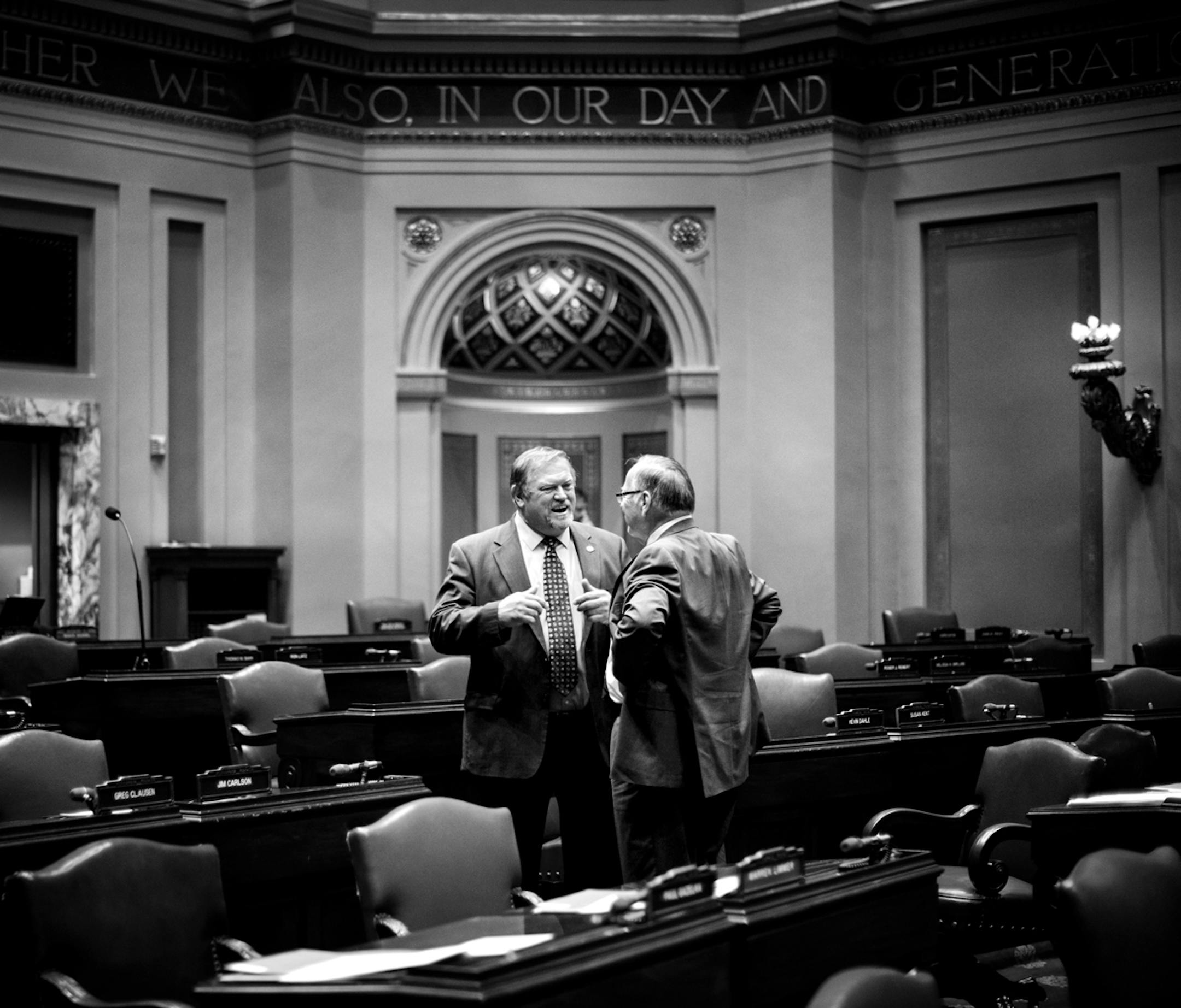 Senate Majority Leader Tom Bakk talked with former Majority Leader Sen. David Senjem R-Rochester, on the mostly empty Senate floor before the start of the day's session. ] GLEN STUBBE * gstubbe@startribune.com Monday, March 31, 2014.