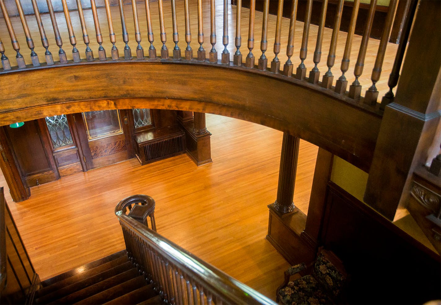 A spiraling staircase leads from the ground floor to the second.