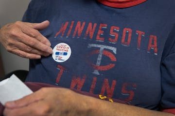 Robert Kelling, 68, placed on a sticker after receiving a COVID-19 Vaccine shot at a Thrifty White in Waseca.