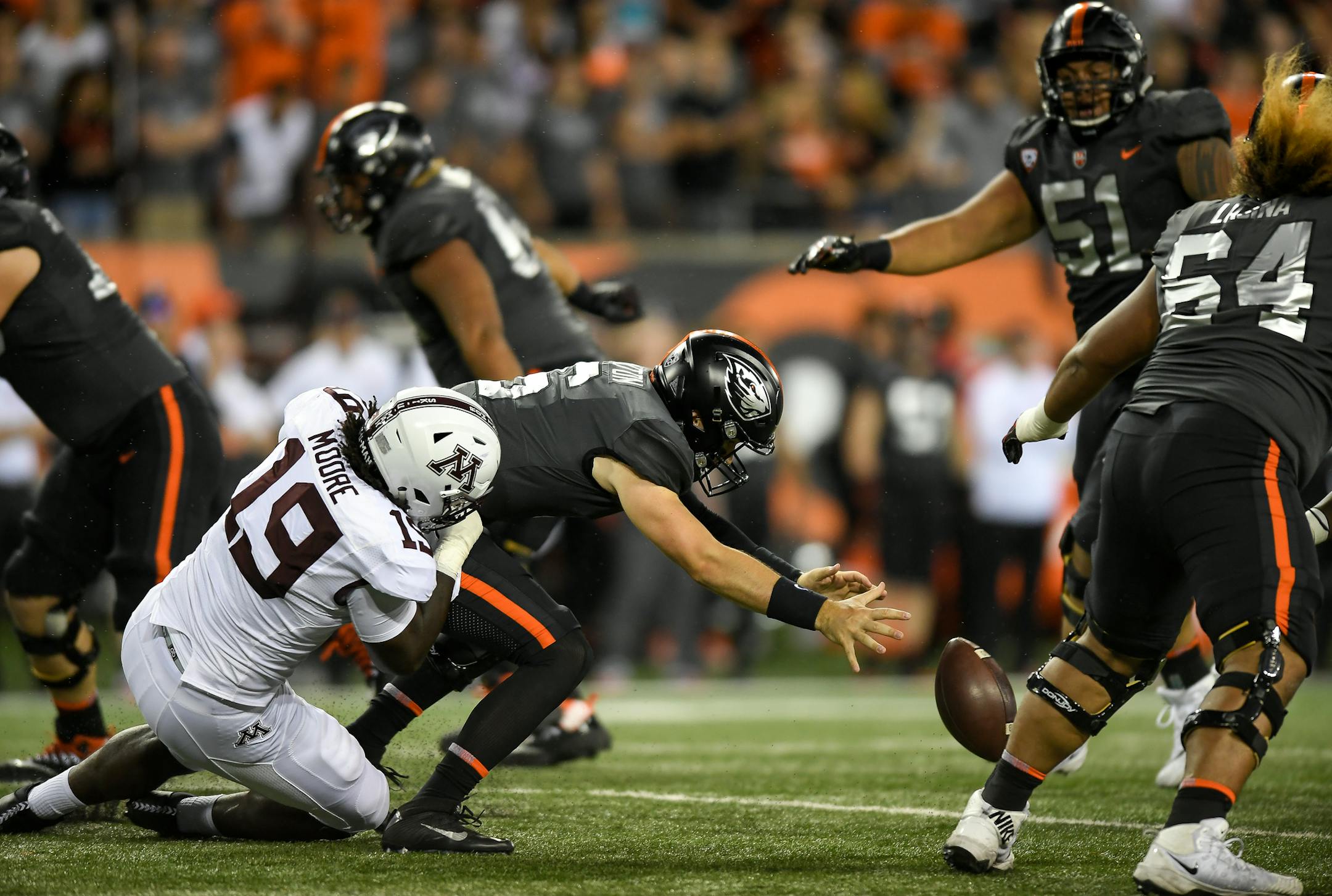Oregon State quarterback Jake Luton (6) fumbles the ball as he is brought down by Minnesota defensive lineman Gary Moore (19) in the first quarter, leading to a turnover on Saturday, Sept. 9, 2017, at Reser Stadium in Corvallis, Ore. (Aaron Lavinsky/Minneapolis Star Tribune/TNS) ORG XMIT: 1210759