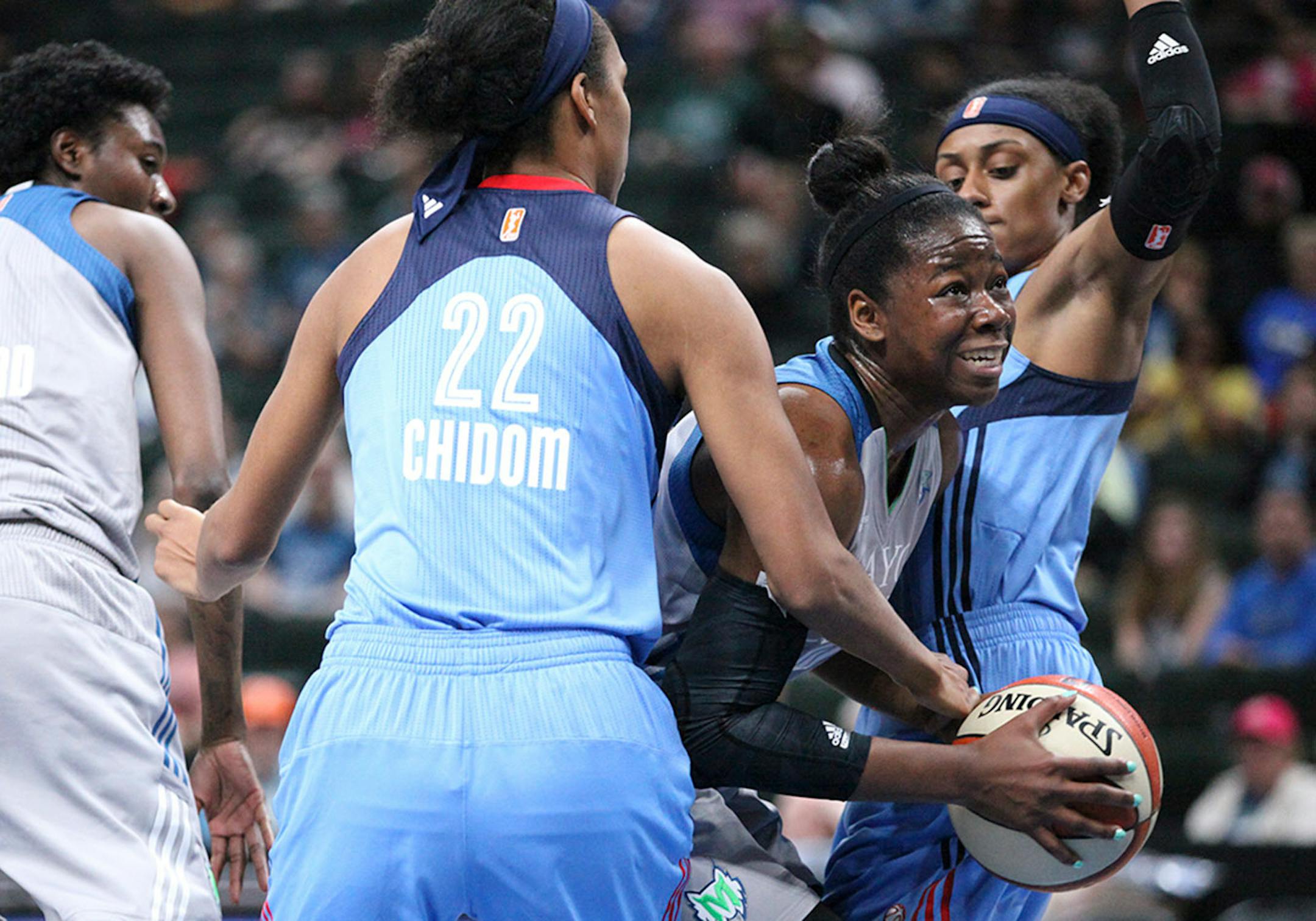 Minnesota Lynx forward Breanna Richardson (4) drives through defenders in the second period.
