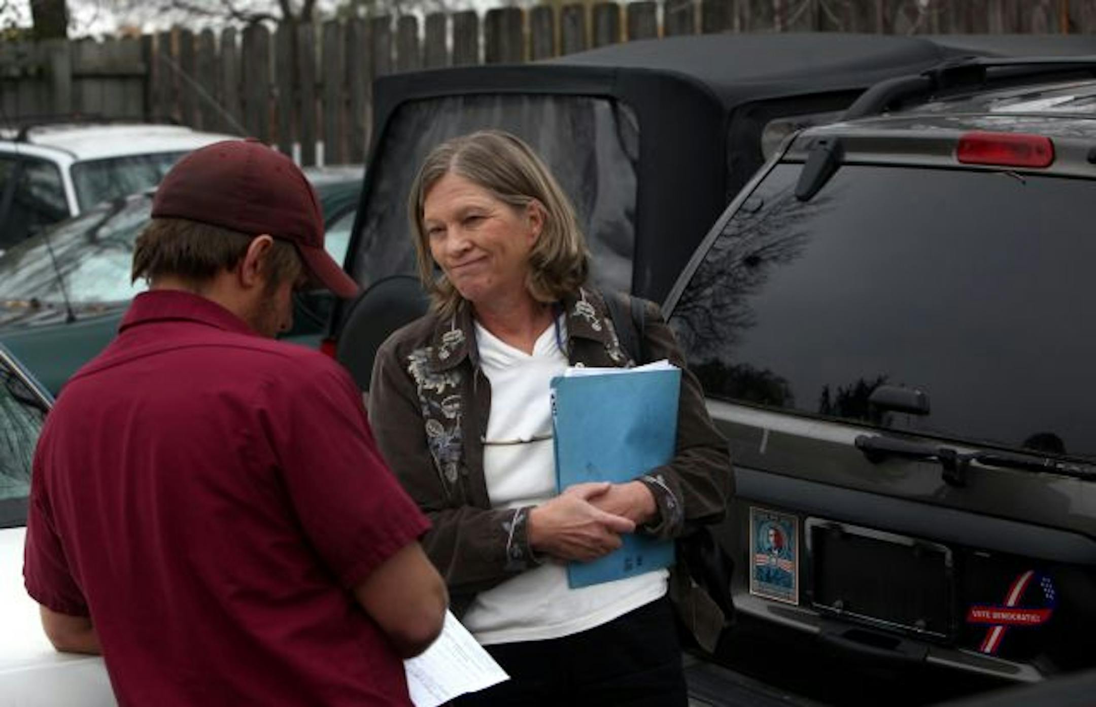Kristin Brown chatted with an employee of Kustum Karriers in Hopkins, where her impounded Jeep has been stored. The vehicle was seized by Edina police in June when Brown's son was charged with DWI. Her attorney successfully argued against the forfeiture attempted by Edina and now wants the law changed.
