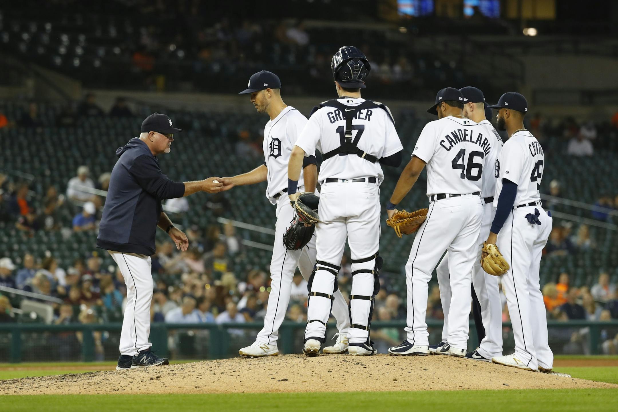 Detroit Tigers manager Ron Gardenhire takes the ball from pitcher Drew VerHagen in the eighth inning of a baseball game in Detroit, Wednesday, Sept. 25, 2019.