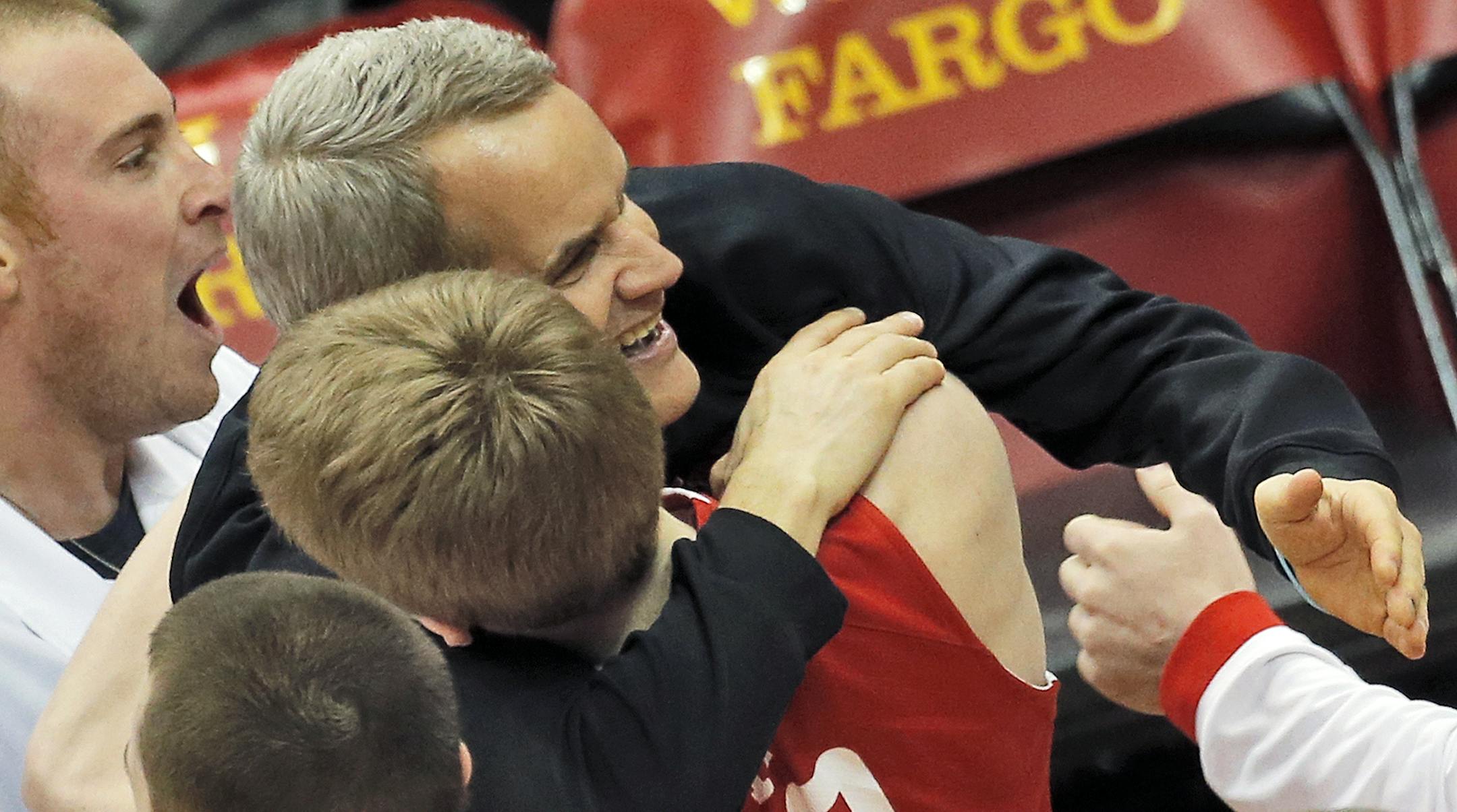 Lakeville North head coach John Oxton hugged J.P. Macura at the final horn. ] Class 4A Boys State Basketball Tournament - Hopkins Royals vs. Lakeville North Panthers Lakeville North won. (MARLIN LEVISON/STARTRIBUNE(mlevison@startribune.com) ORG XMIT: MIN1403152332080305