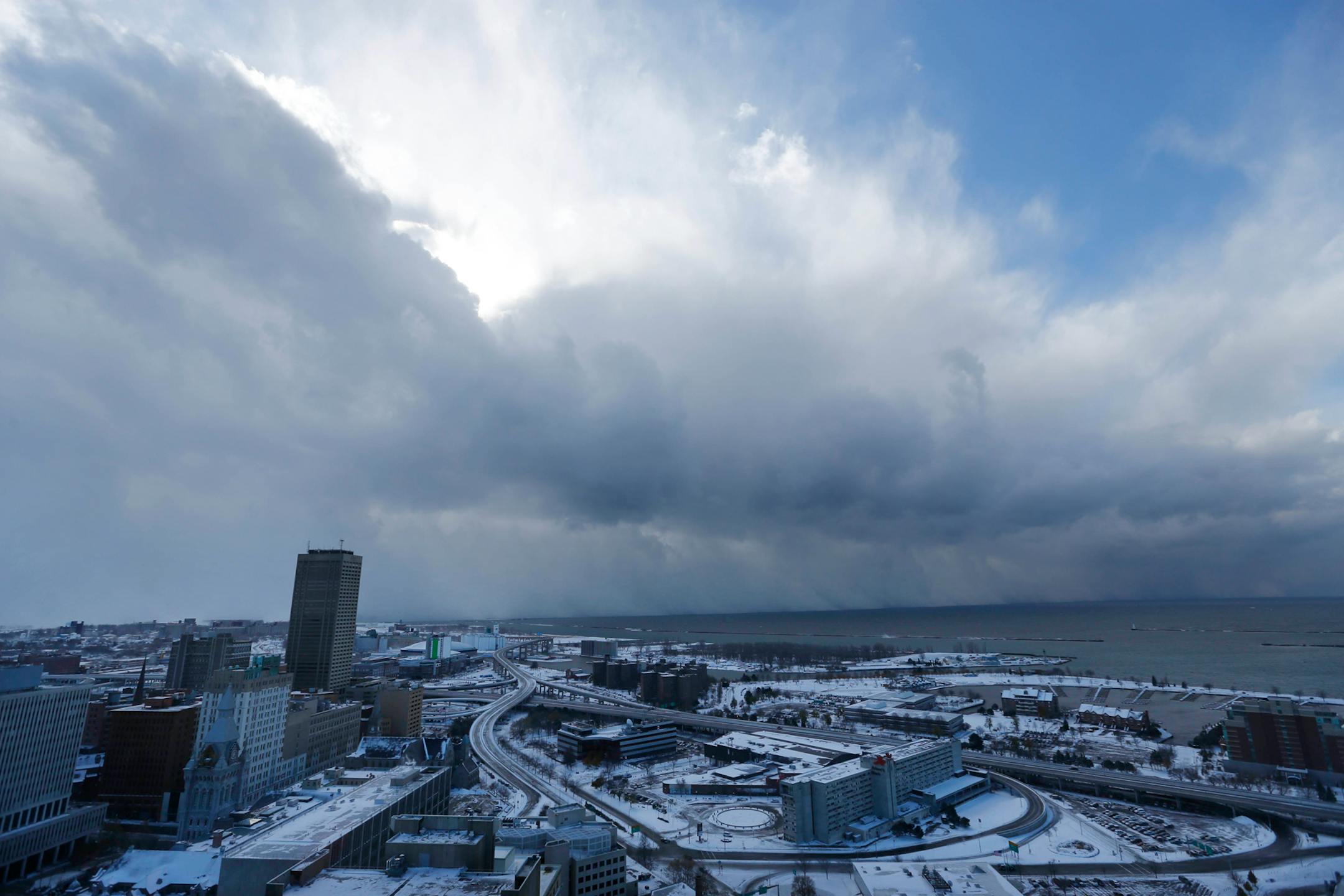 A massive band of lake effect snow moves through the south of Buffalo, N.Y. on Tuesday, Nov. 18, 2014. Several feet of lake-effect snow paralyzed the Buffalo area Tuesday, forcing state troopers to deliver blankets and other supplies to motorists stranded on the New York State Thruway and adding an ominous note to a wintry season that�s already snarling travel and numbing fingers from the Midwest to the Carolinas. (AP Photo/The Buffalo News, Derek Gee)