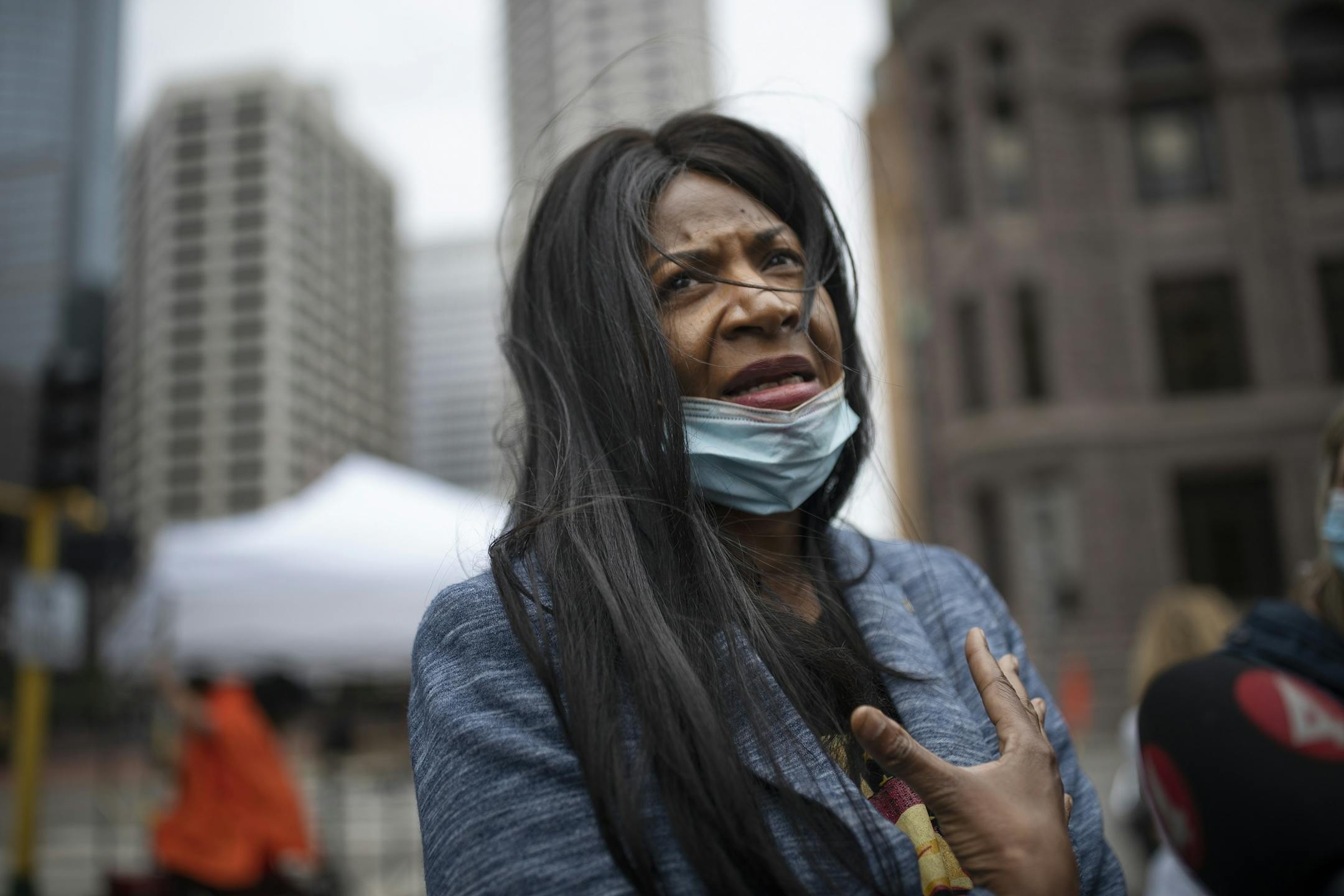 George Floyd 's aunt Angela Harrelson of Minneapolis spoke with members of the media outside of the Hennepin County Public Safety Facility Monday morning .