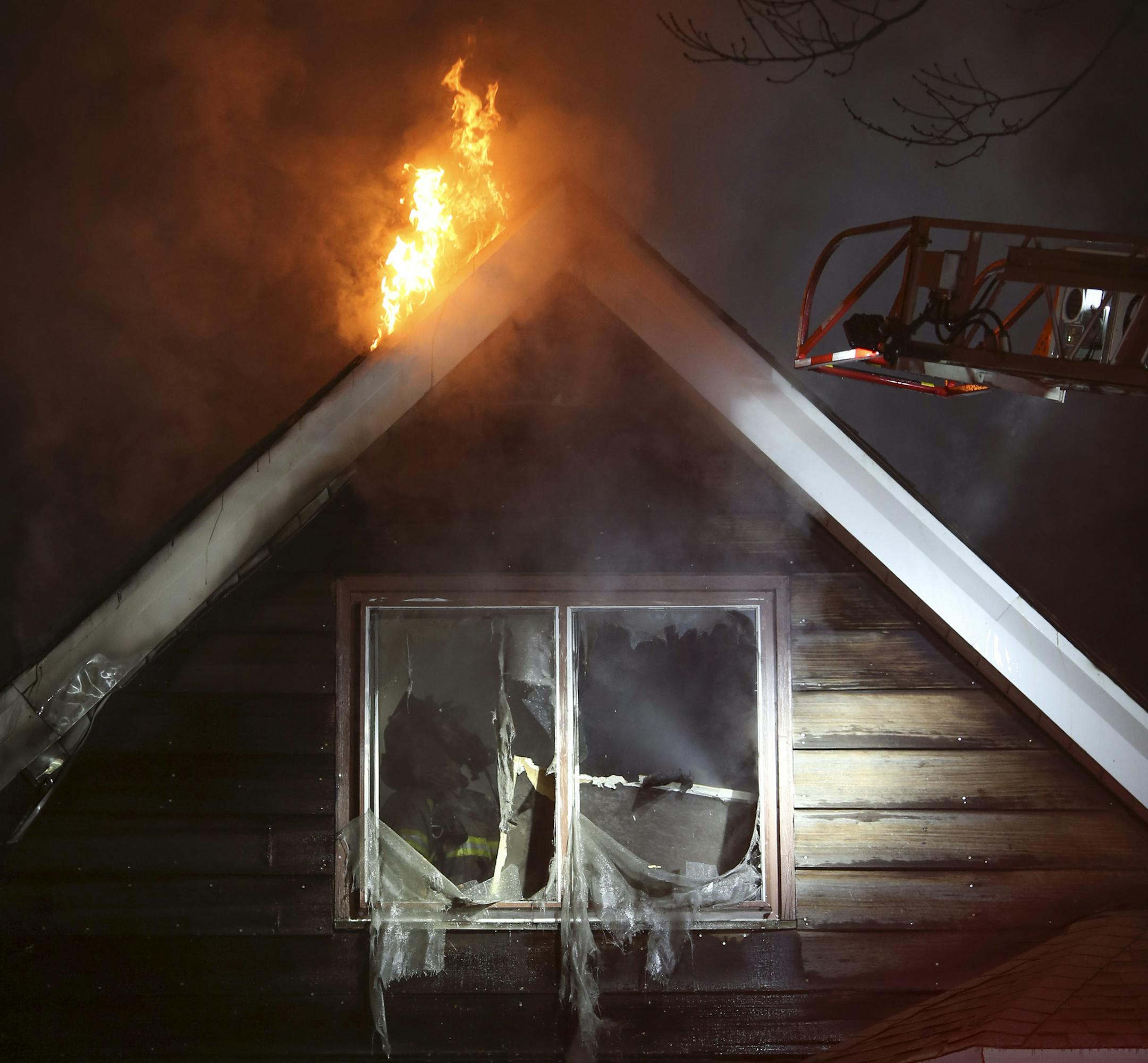 Firefighters battled stubborn flames in the attic of the house at 599 E. Jessamine Ave. Sunday night. ] JEFF WHEELER ‚Ä¢ jeff.wheeler@startribune.com Four residents of a house at 595 E. Jessamine Ave. in St. Paul suffered from smoke inhalation, one of them, a three year-old girl, seriously, when their house caught fire Sunday night, February 8, 2015. The house then spread to the house next door at 599 E. Jessamine Ave. Firefighters had two simultaneous fires to fight when they a