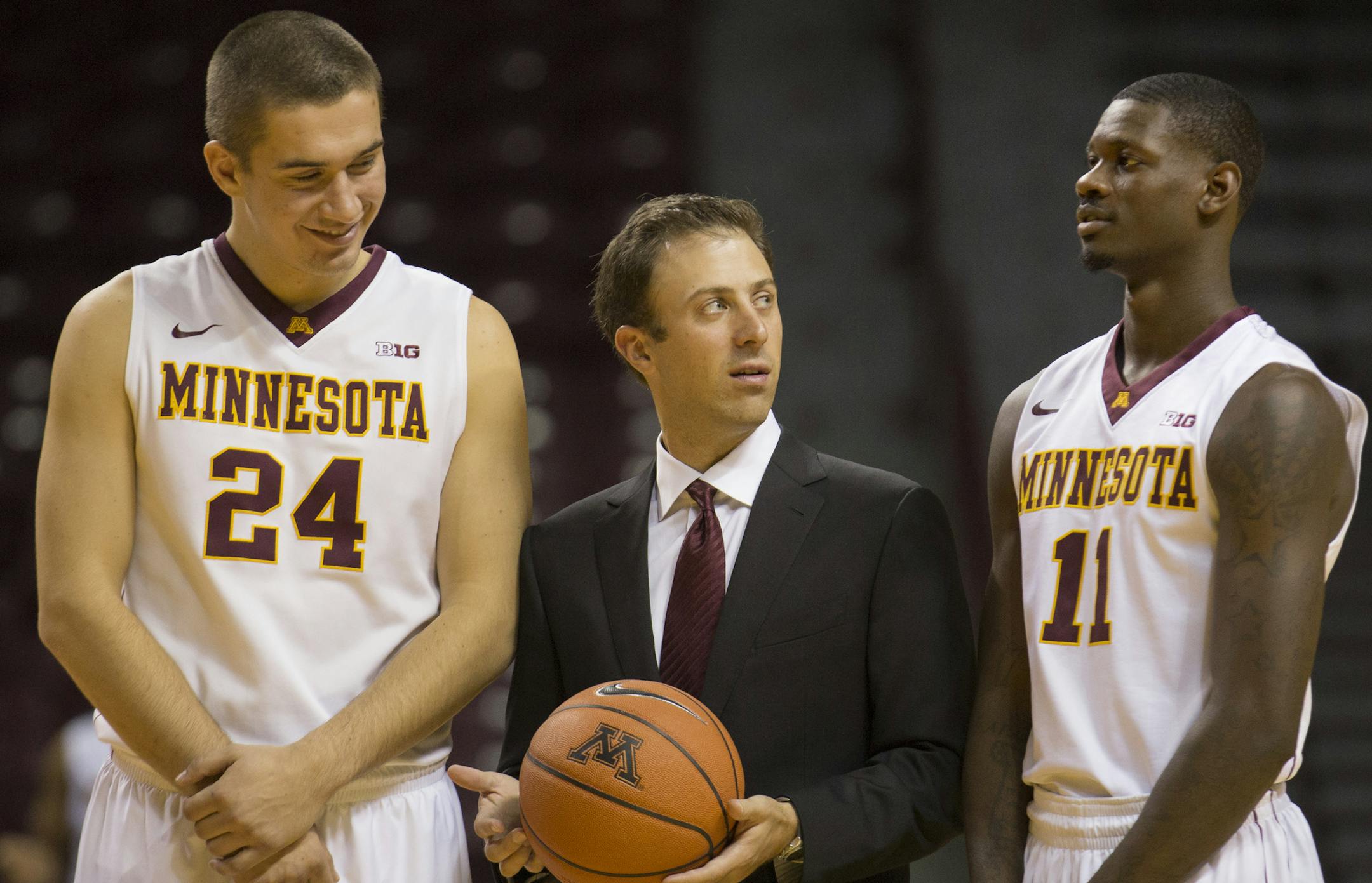 Gophers coach Richard Pitino checks senior guard Carlos Morris for a smile during a photo session on media day. Senior forward Joey King (left). ] Brian.Peterson@startribune.com MINNEAPOLIS, MN - 10/21/2015