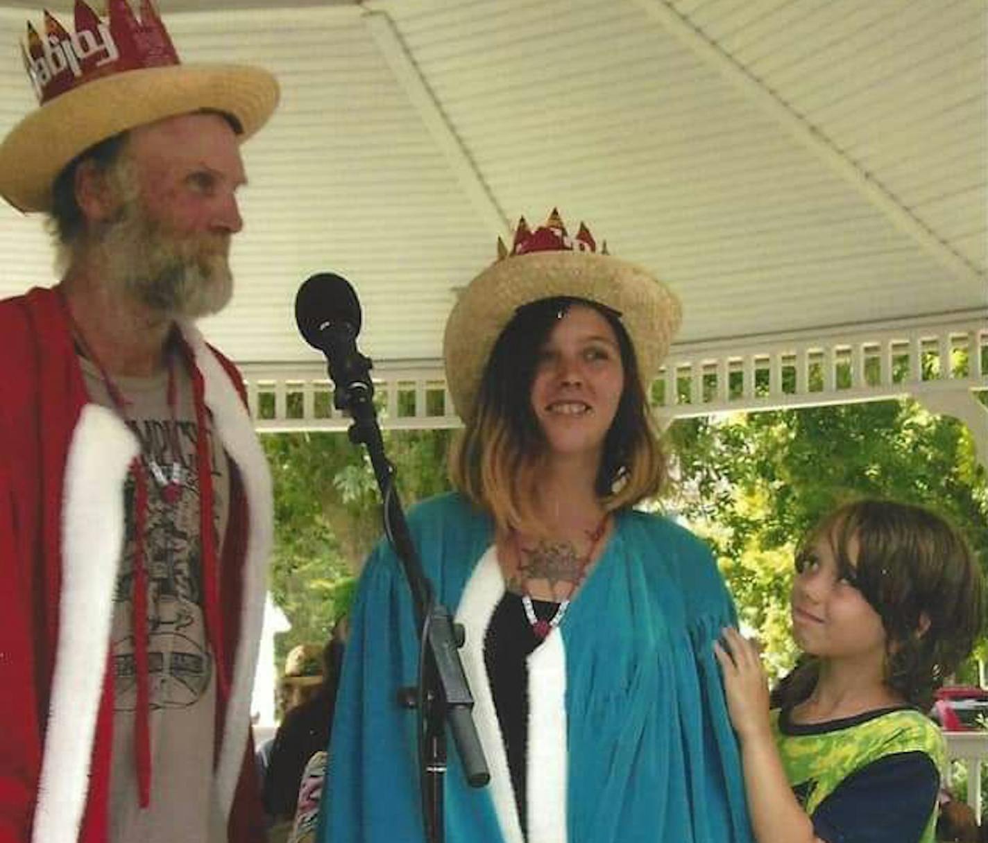 Colleen "Crash" Burke recieves her Hobo Queen crown in Britt, Iowa, alongside Hobo King "Dutchman" and her son. ORG XMIT: 0AY1hAF-UFg0Md4O6JfC