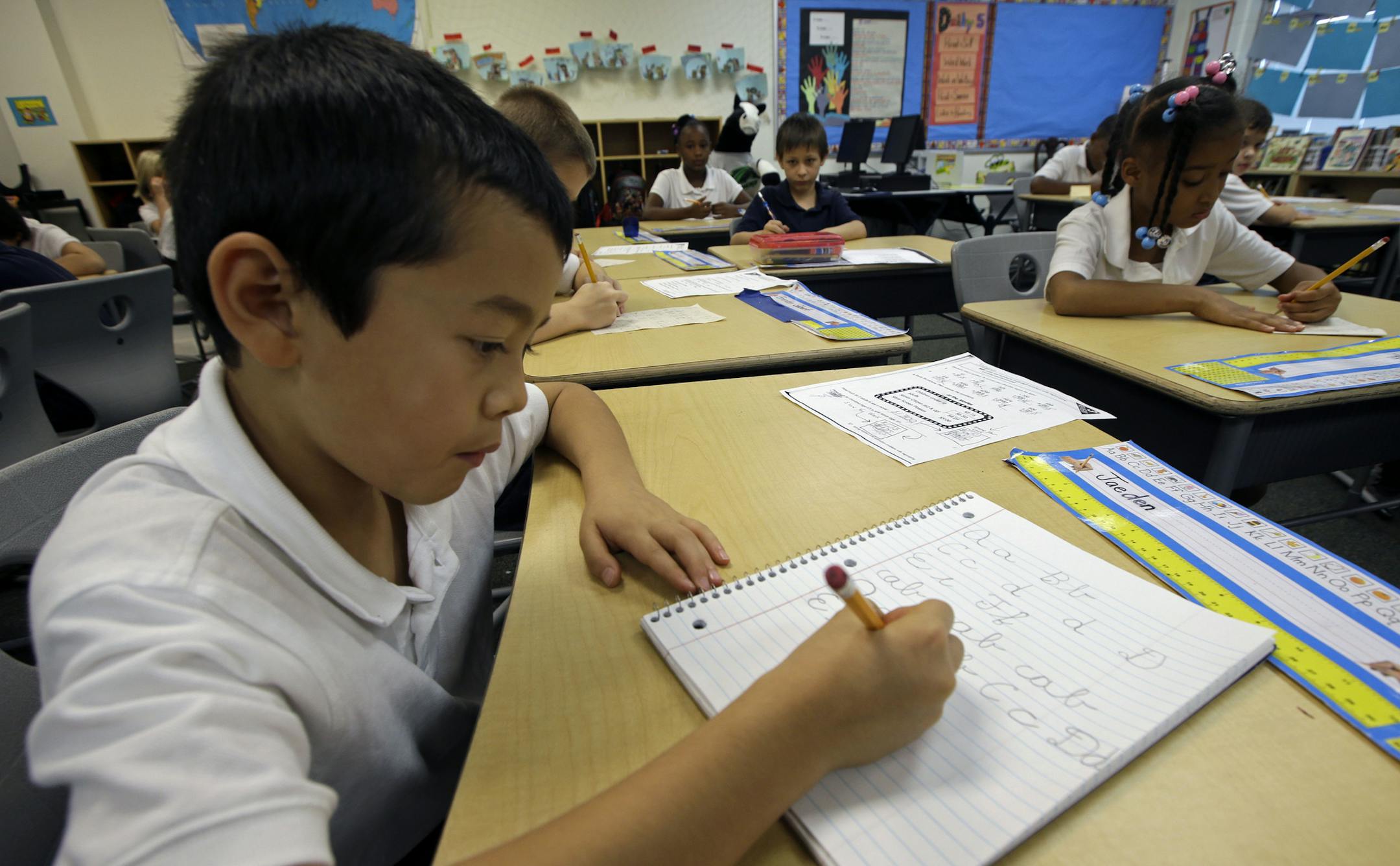 Jaeden Alvarez practiced cursive writing at Cleveland K-6 School in Dayton, Ohio.