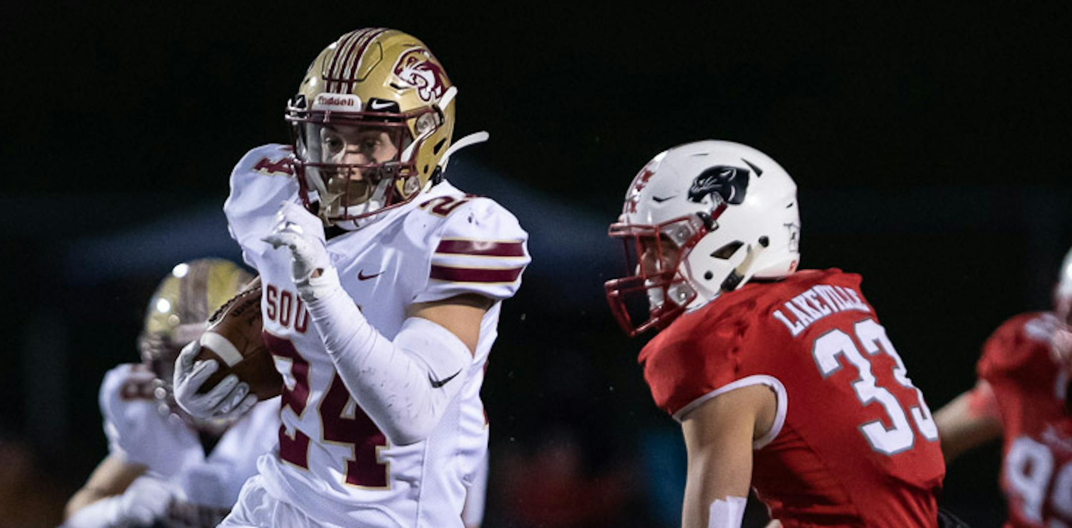 Lakeville South RB Johnny Shabaz (24) breaks a tackle from Lakeville North defensive back Carter Patterson (33) and scores a touchdown. [ Special to Star Tribune, photo by Matt Blewett, Matte B Photography, matt@mattebphoto.com, October 3, 2019, Lakeville North High School, Lakeville, Minnesota, SAXO 1009672801 PREP.lake