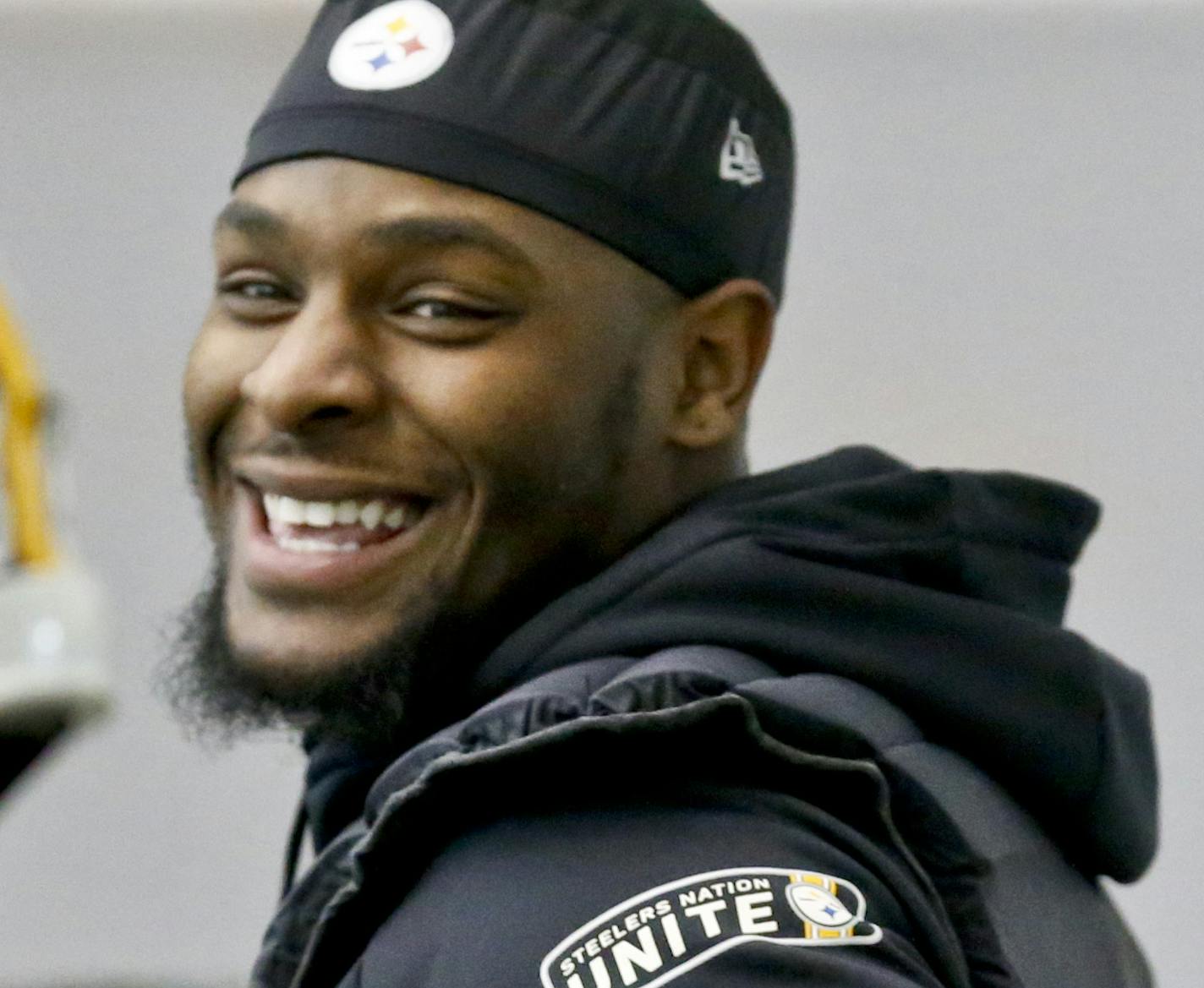 Pittsburgh Steelers running back Le'Veon Bell (26), right, smiles while talking to running back Fitzgerald Toussaint (33) as he participates in an NFL football practice, Thursday, Jan. 11, 2018, in Pittsburgh. The Steelers host the Jacksonville Jaguars in a divisional playoff on Sunday. (AP Photo/Keith Srakocic) ORG XMIT: PAKS