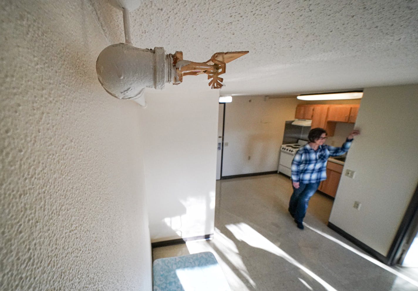 The sprinkler retrofitting of St Paul&#x2019;s Ravoux High-Rise was completed in 2012.&#xa0; This is one of the apartments on the fourth floor. The building's assistant housing manager Julianna Quast, right, said most fires in residential units occur in the kitchen. ] GLEN STUBBE &#x2022; glen.stubbe@startribune.com Wednesday, December 4, 2019 The St. Paul Public Housing Authority spent 23 years adding sprinklers to every unit on every floor of its 16 high-rises. Because of that, a former fire o