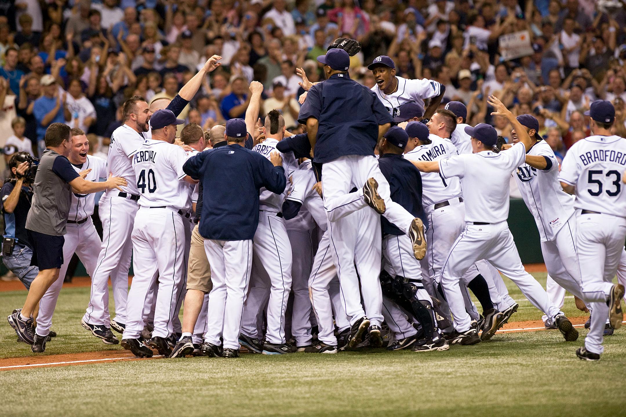 Tampa Bay Rays players celebrate a 7-2 win over the Minnesota Twins to clinch a playoff spot during a baseball game Saturday, Sept. 20, 2008 in St. Petersburg, Fla.