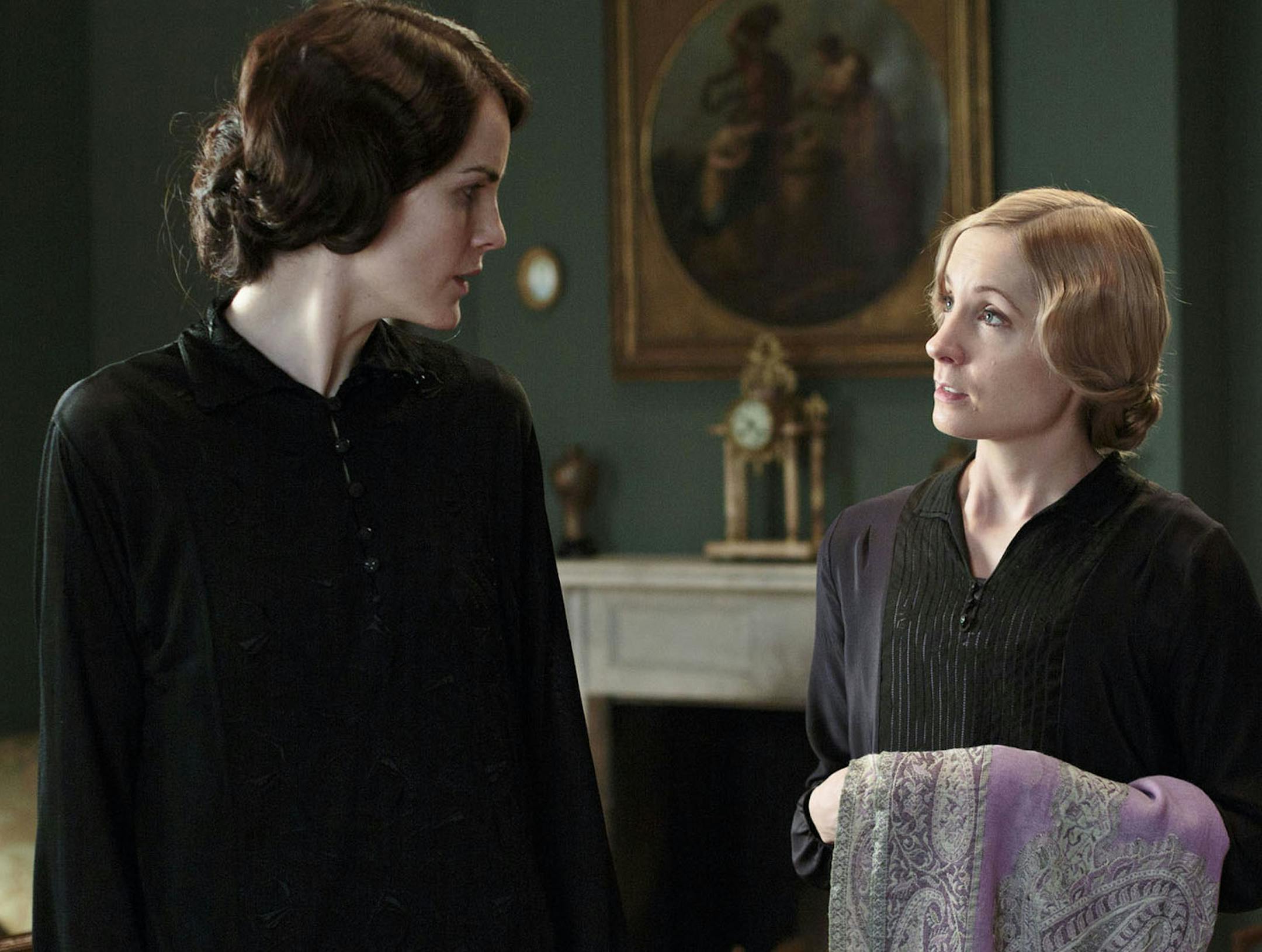 This photo released by PBS and Carnival Film and Television Limited shows, from left, Michelle Dockery as Lady Mary, and Joanne Froggatt as Anna Bates, in a scene from season four of the Masterpiece TV series, "Downton Abbey." As it returns for its much-awaited fourth season, "Downton Abbey" remains a series about elegance, tradition and gentility, and the pressures of preserving them. The show premieres Sunday, January 5, 2014 at 9 pm ET on PBS. (AP Photo/PBS/Masterpiece, Nick Briggs) ORG XMIT: