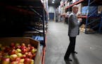 Rob Zeaske, CEO of Second Harvest Heartland, walks some of the aisles of the warehouse Tuesday, Feb. 27, 2018, in Maplewood, MN. The food rescue syste