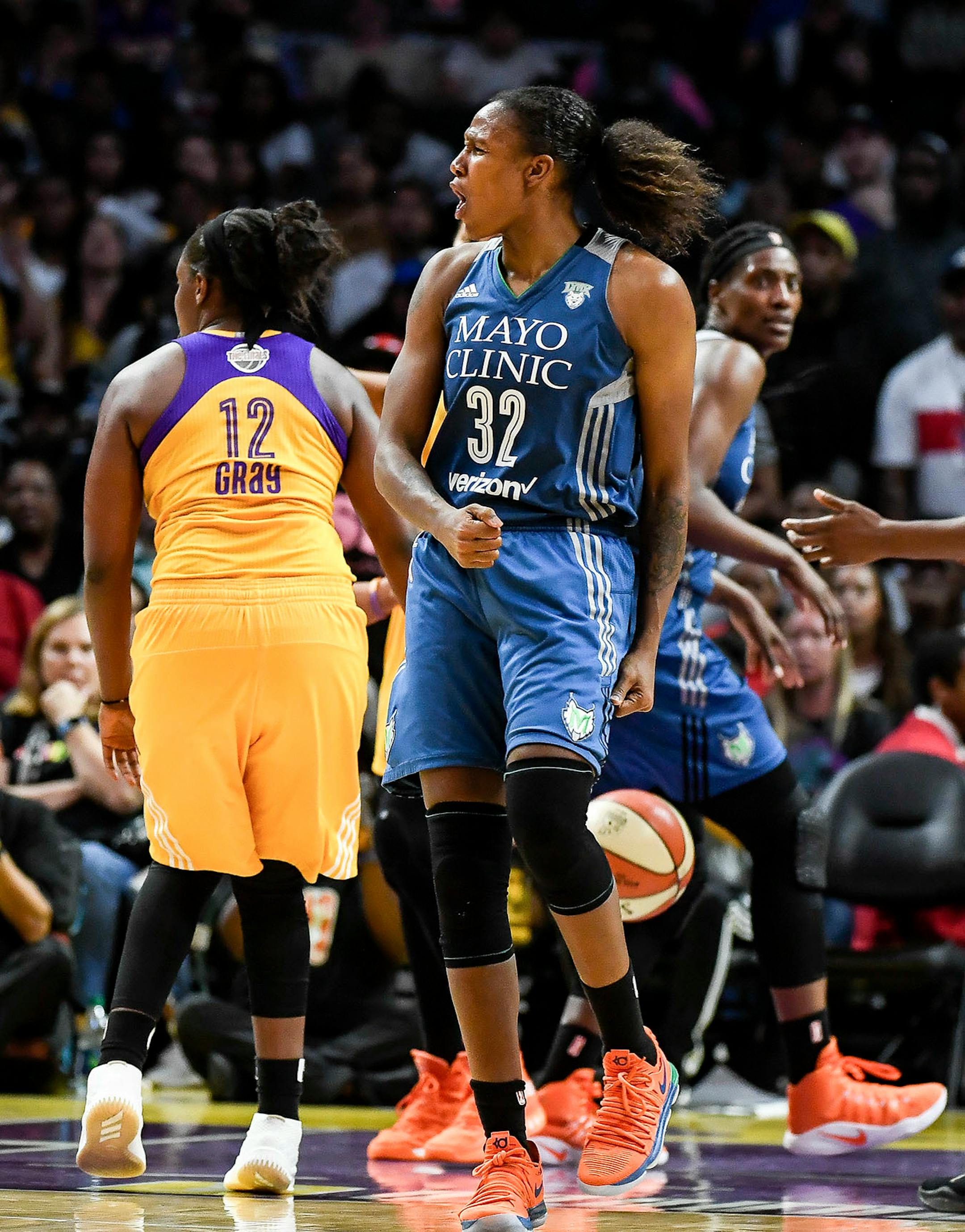 Minnesota Lynx forward Rebekkah Brunson (32) celebrated after she was fouled driving toward the basket in the second half.